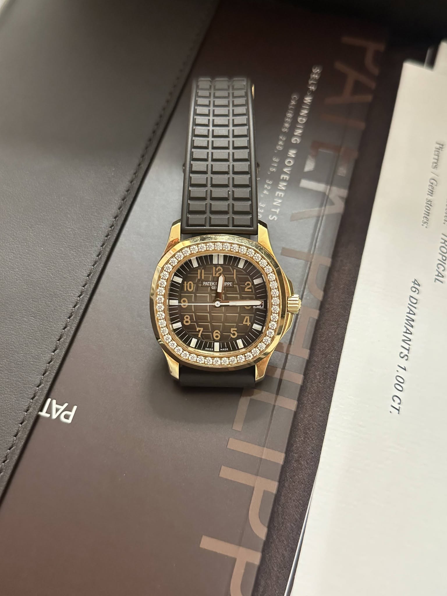 May be an image of wrist watch and text