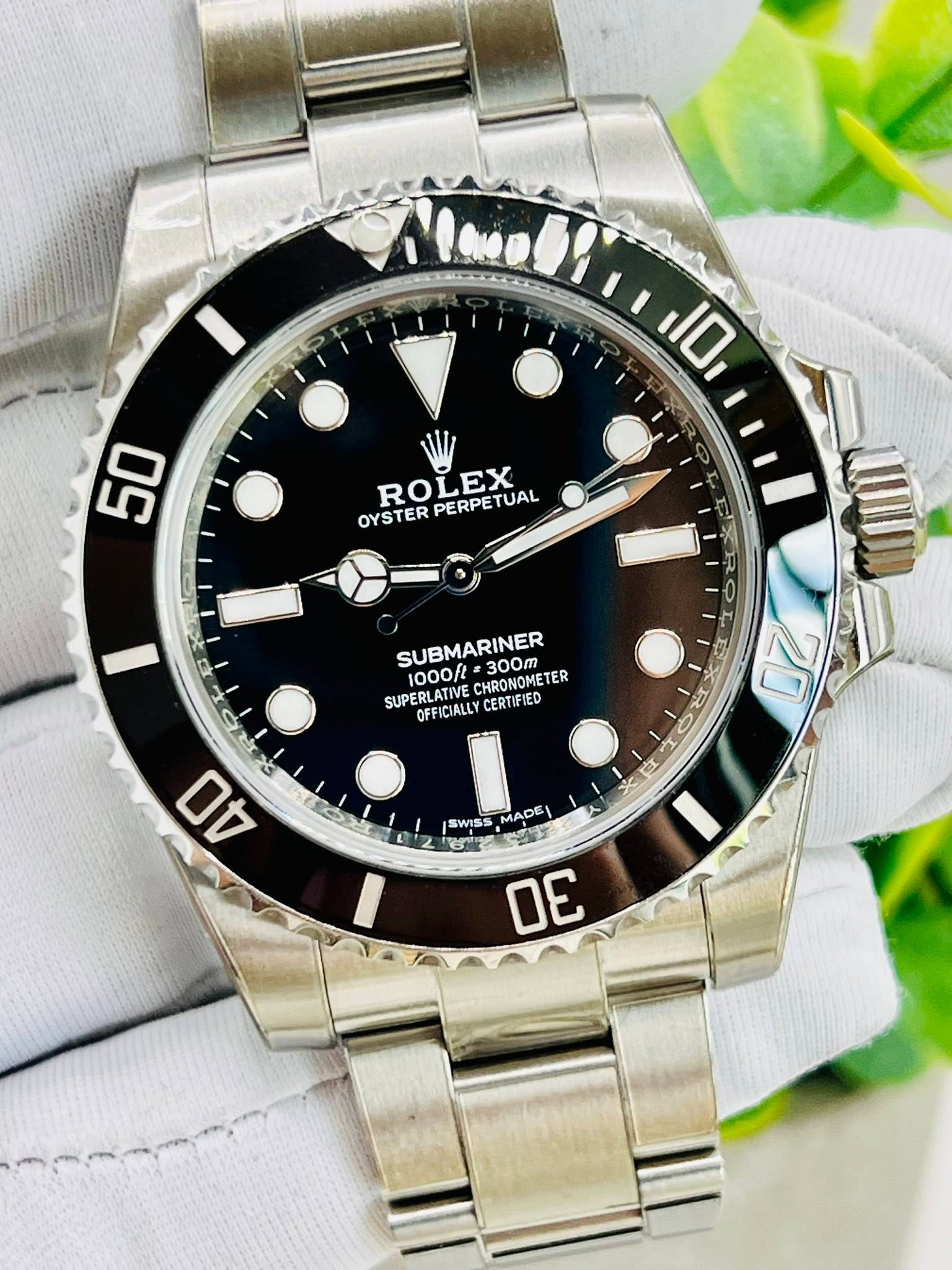 May be an image of wrist watch and text that says '110 50 OYSTERPERPETUAL ROLEX LEX OYSTER PERPE PERPETUAL TUAL P SUBMARINER 300m SUPERLATIVE OFFICIALLY CERTIFIED CHRONOMETER ER 20…