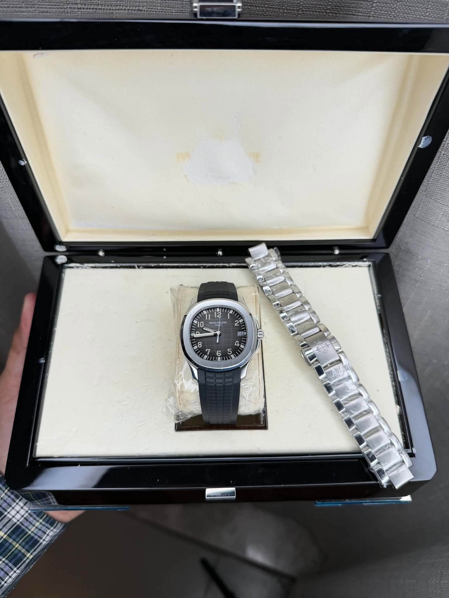 May be an image of wrist watch and text