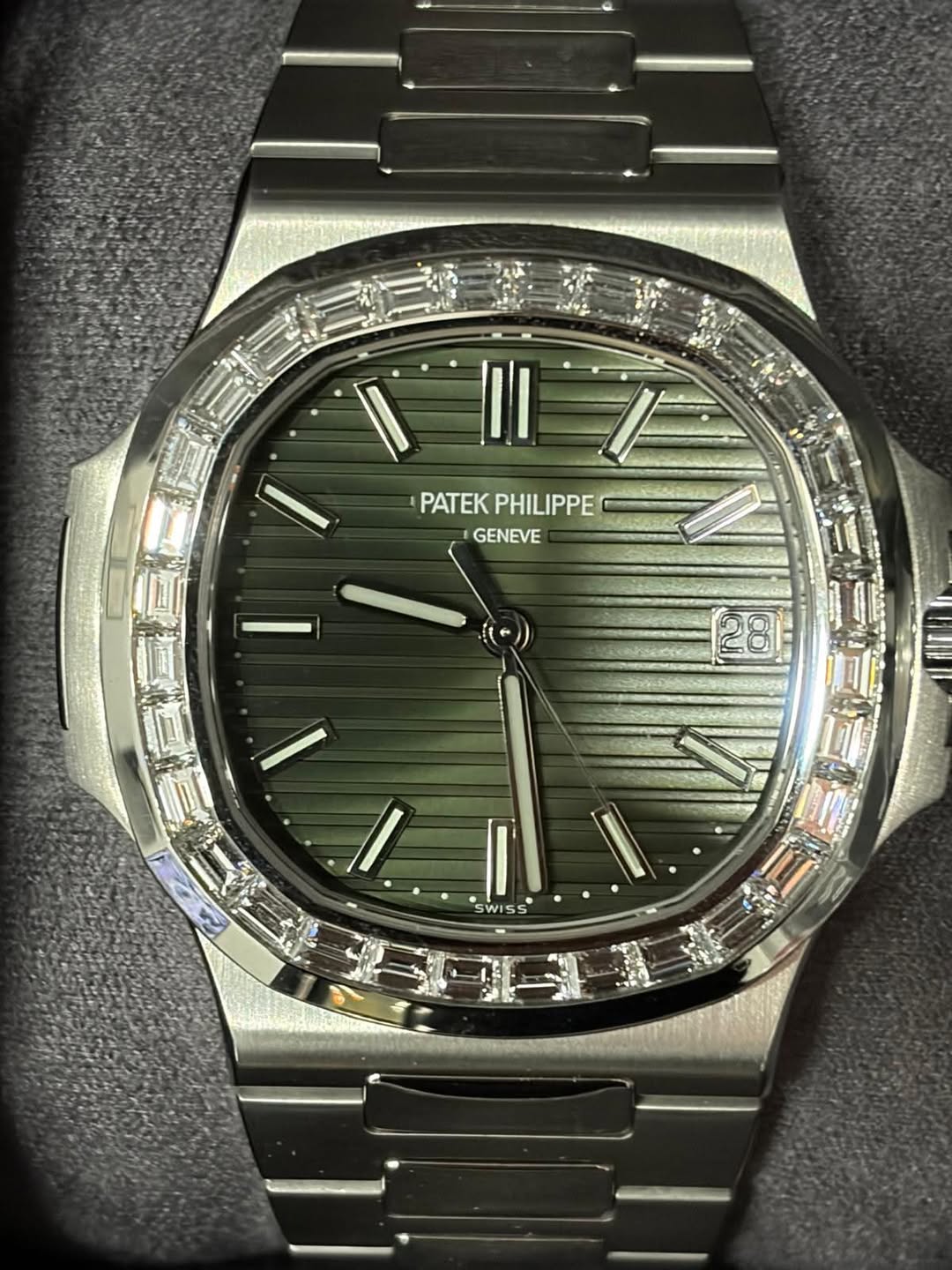 May be an image of wrist watch and text