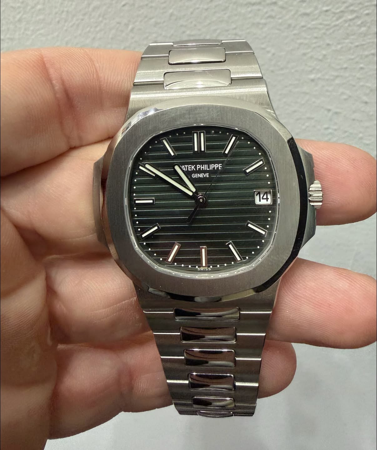 May be an image of wrist watch and text