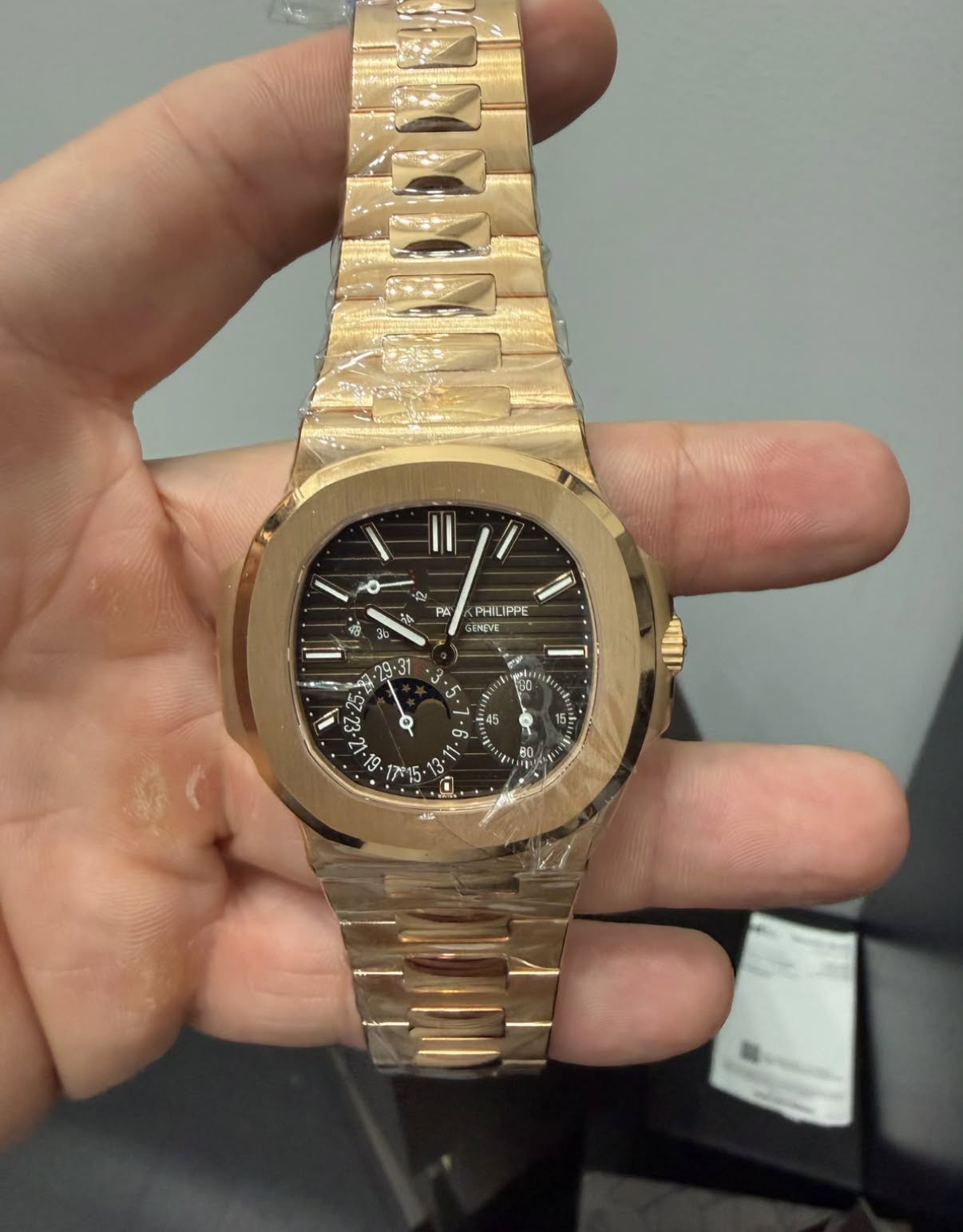 May be an image of wrist watch and text