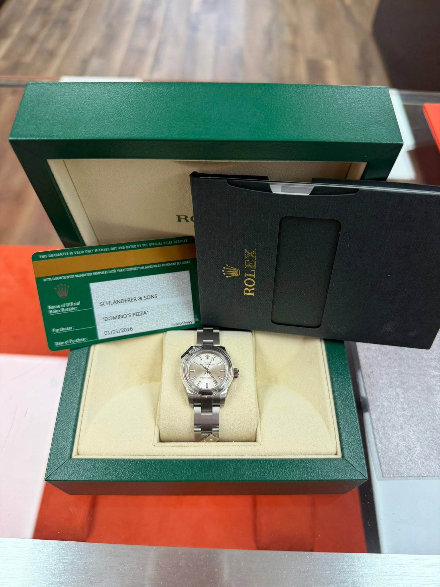 May be an image of wrist watch and text
