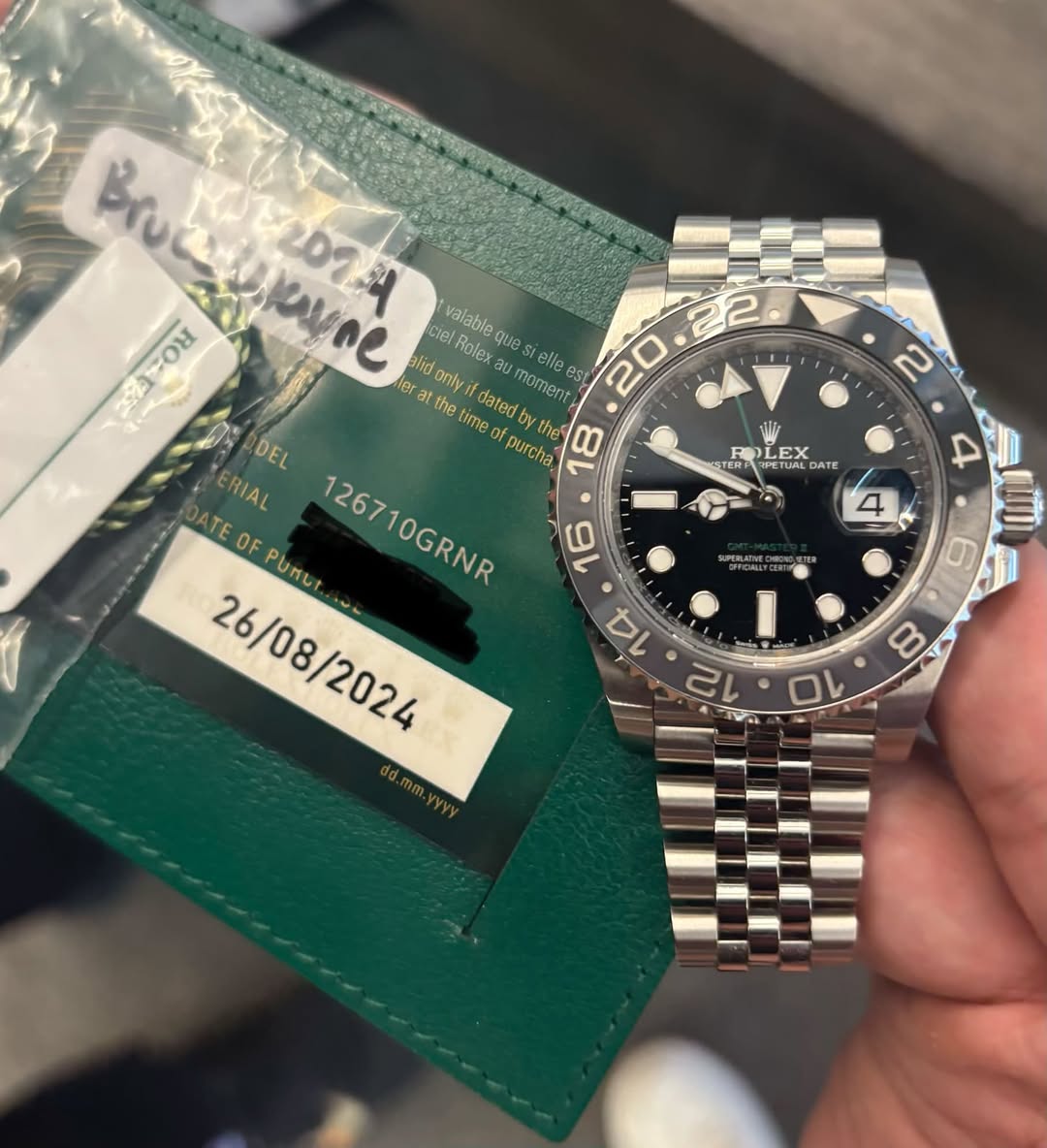 May be an image of wrist watch and text