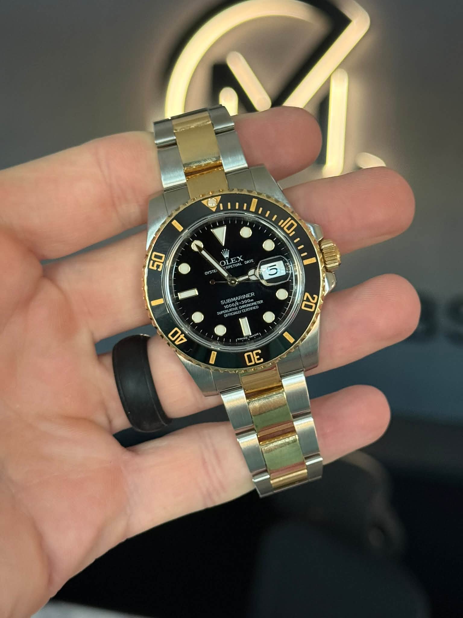 May be an image of wrist watch and text