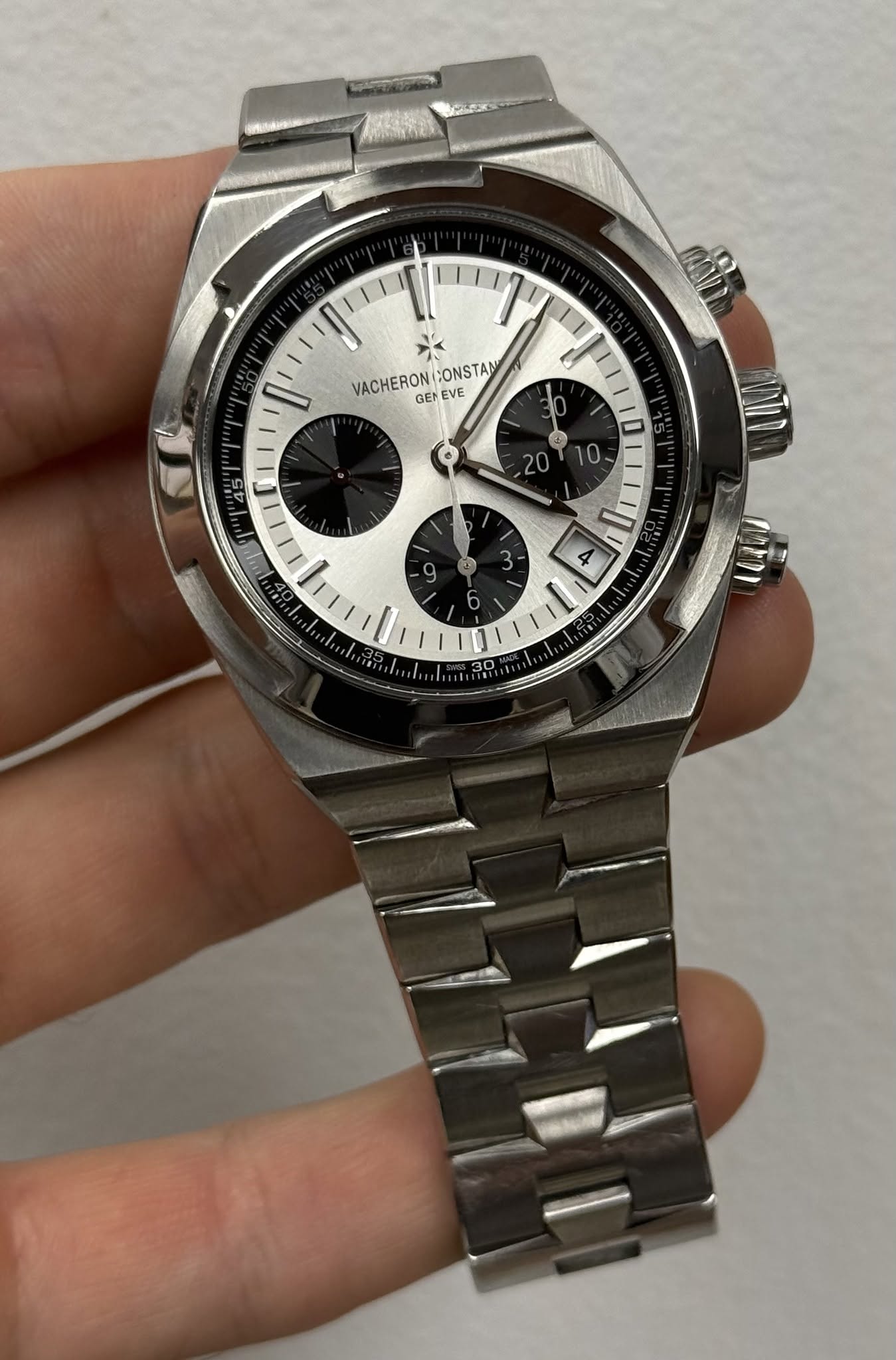 May be an image of wrist watch and text