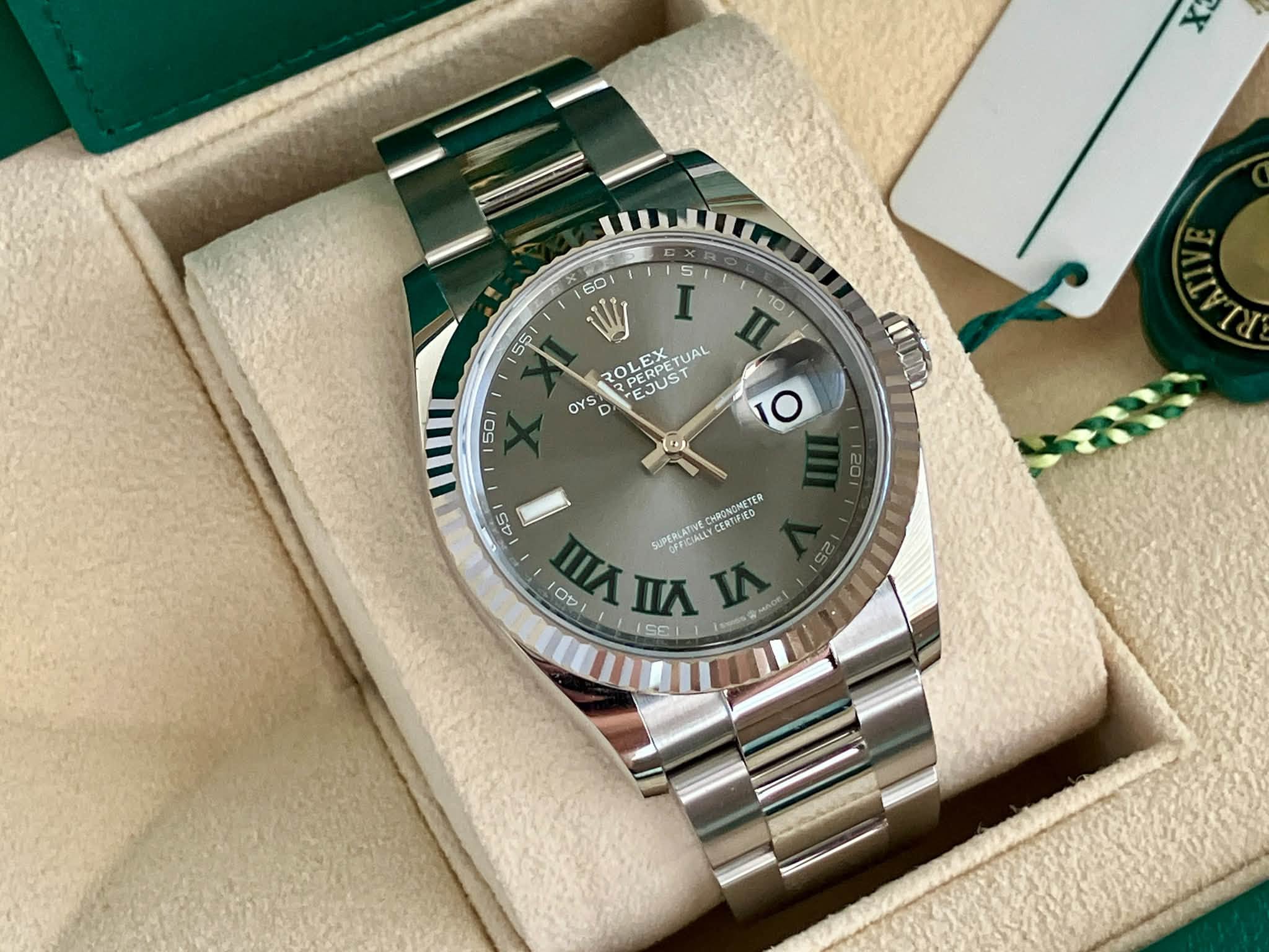 May be an image of wrist watch and text