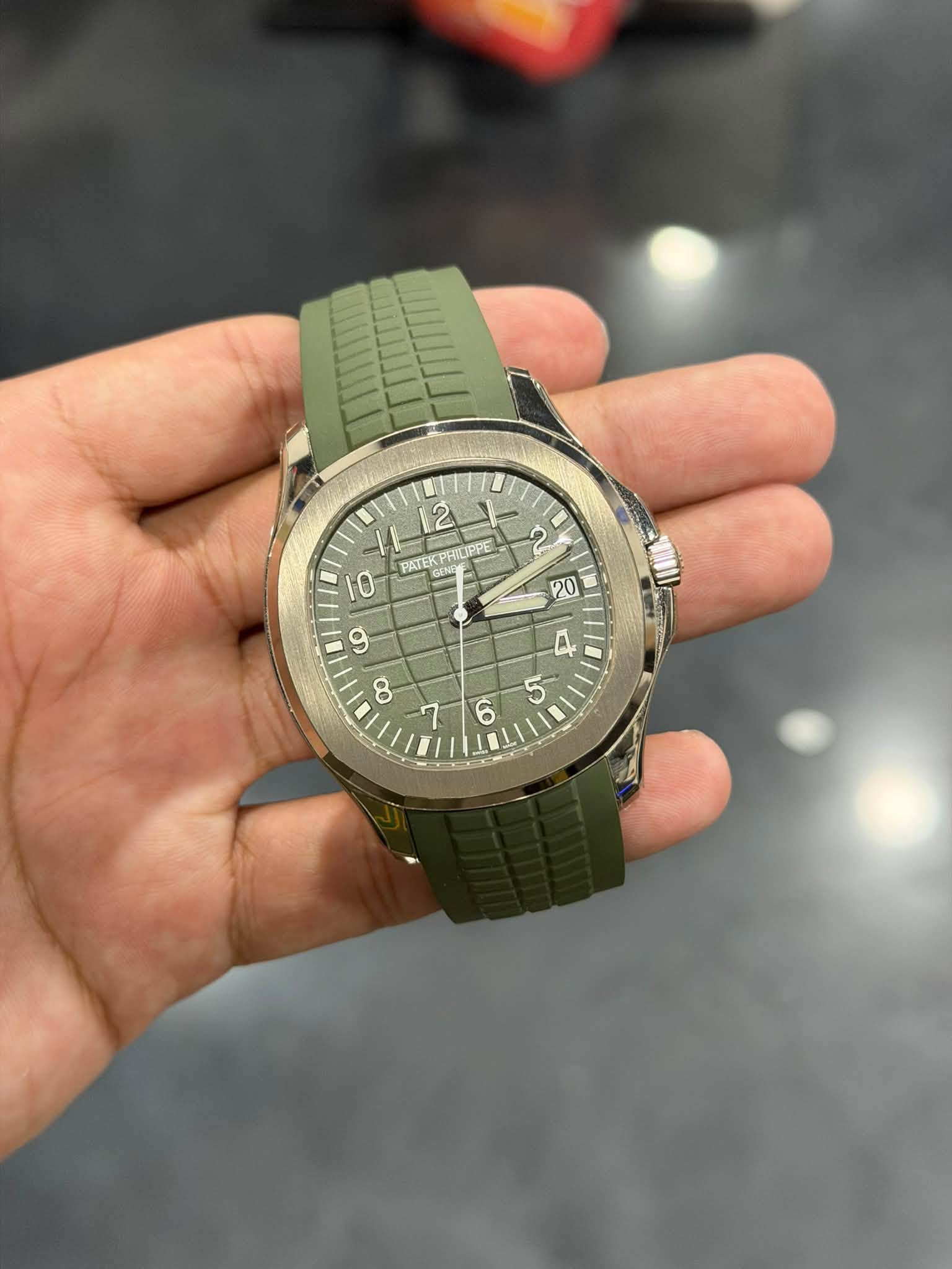 May be an image of wrist watch and text
