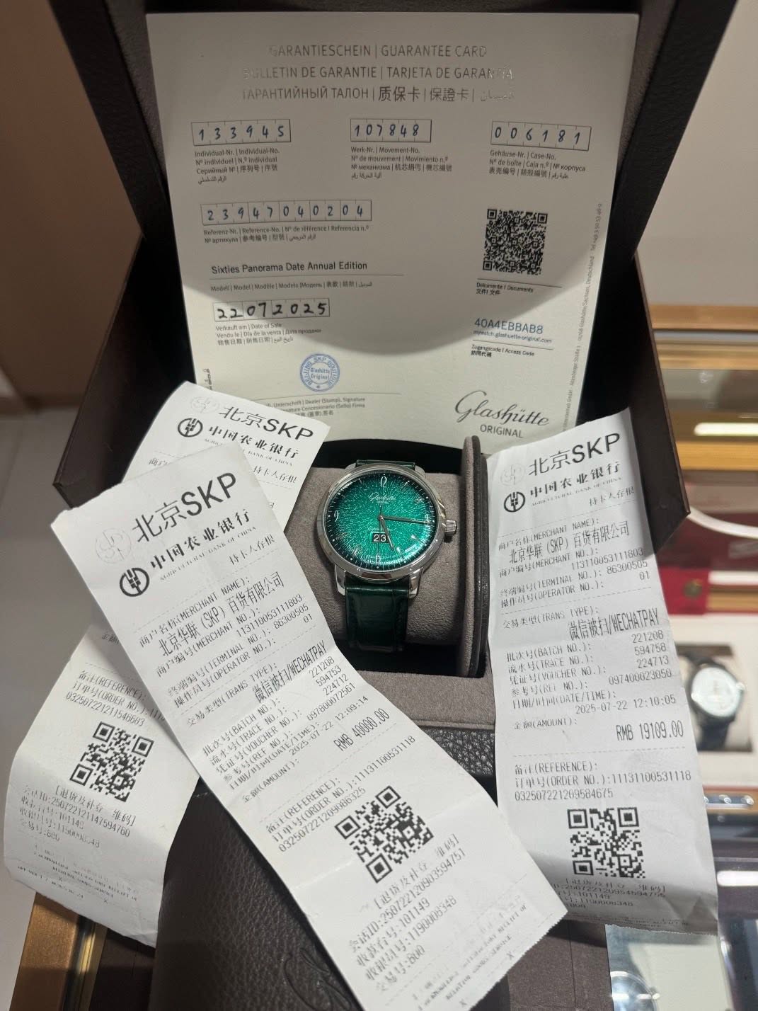 May be an image of digital watch, ticket stub and text