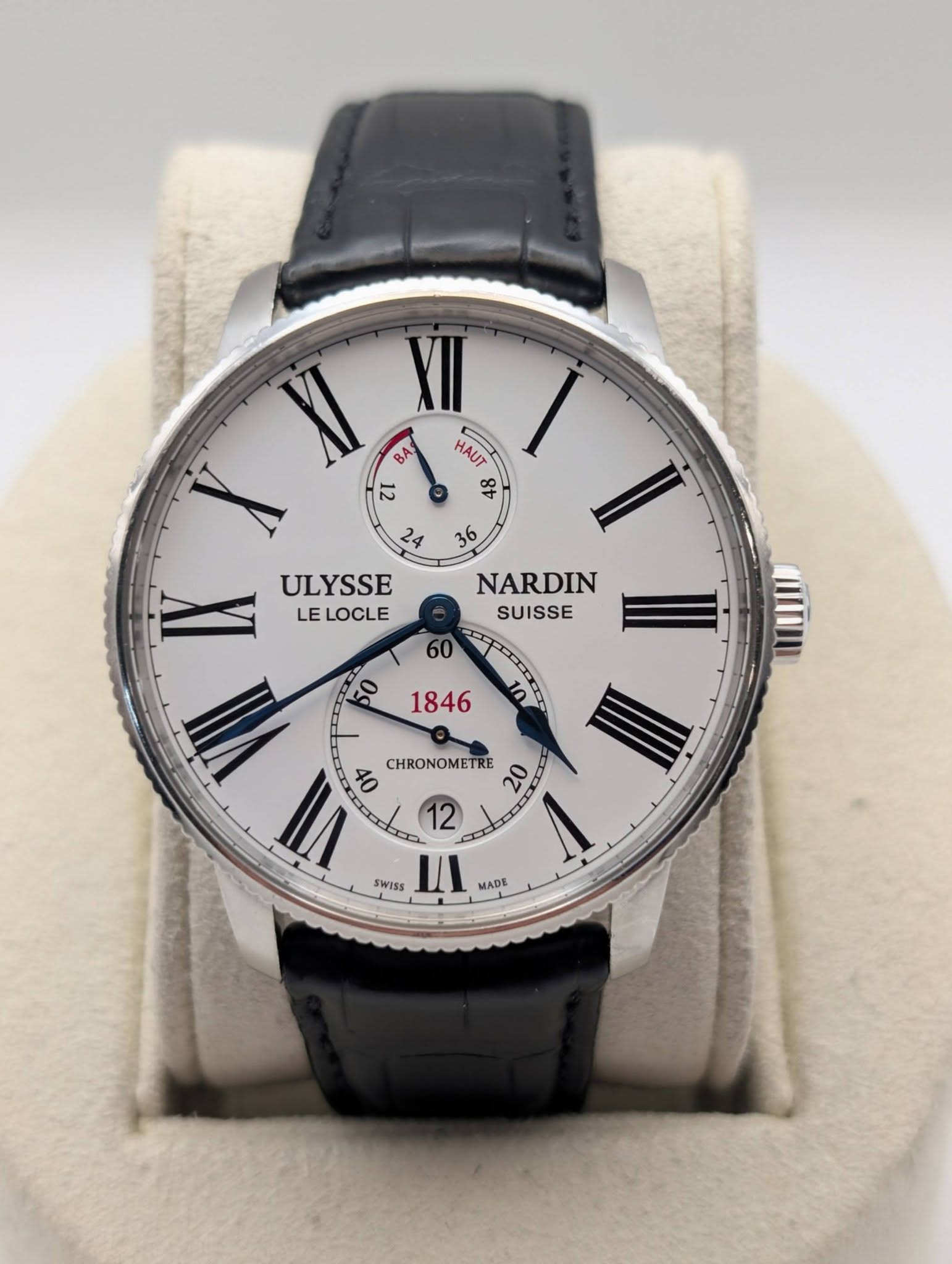 May be an image of wrist watch and text that says 'BA 12 HAUT 8t 24 36 ULYSSE LE LOCLE NARDIN SUISSE CHRONOMETRE 20 12 SWISS WISS II MADE'