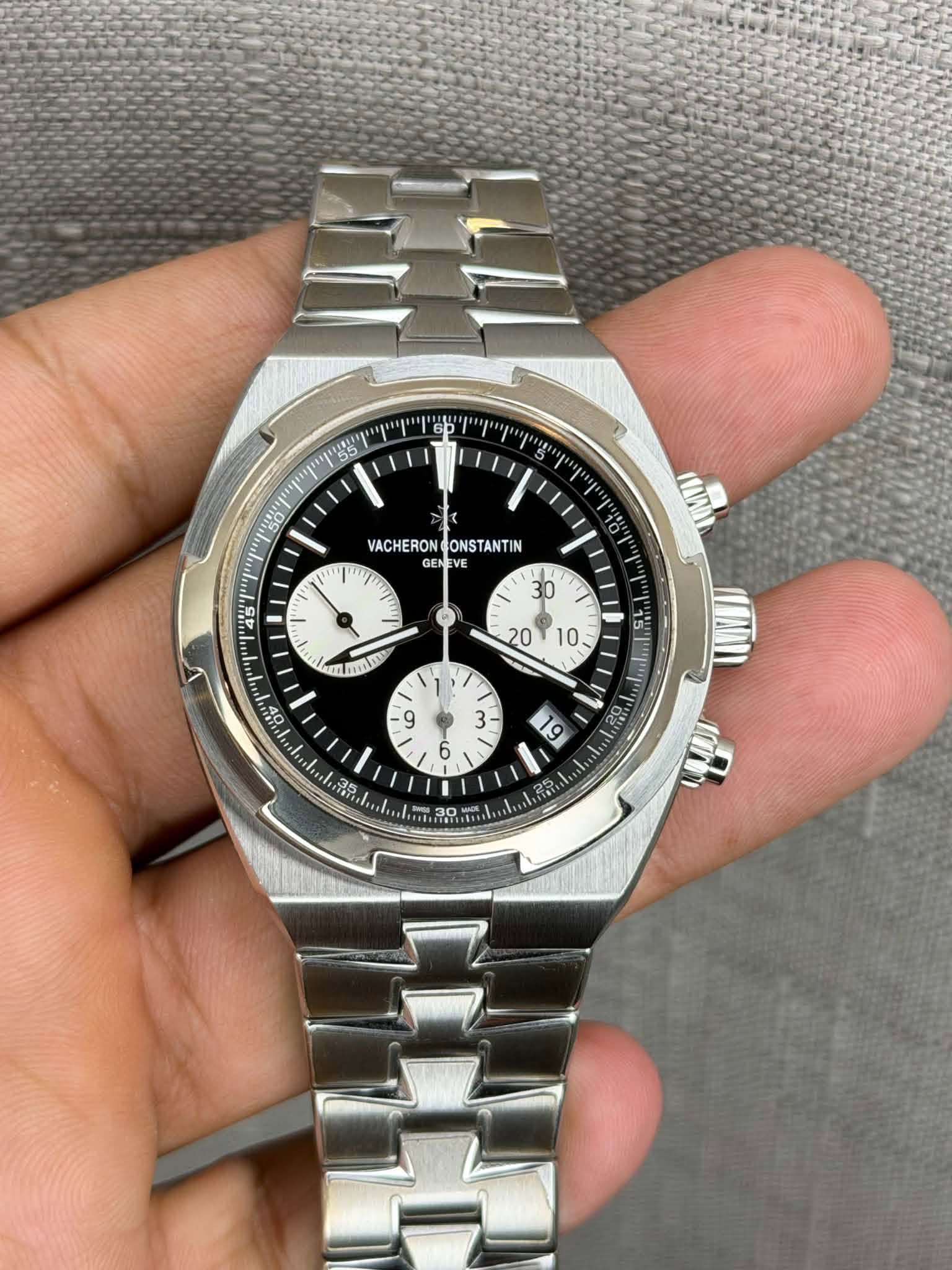May be an image of wrist watch and text