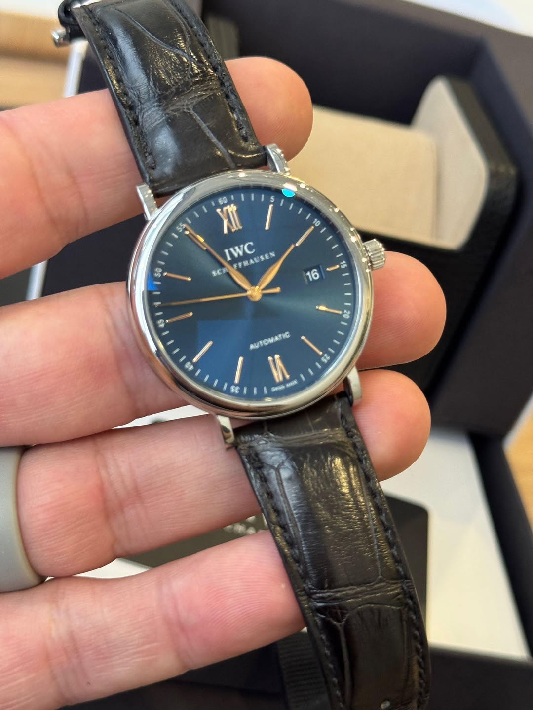 May be an image of wrist watch and text