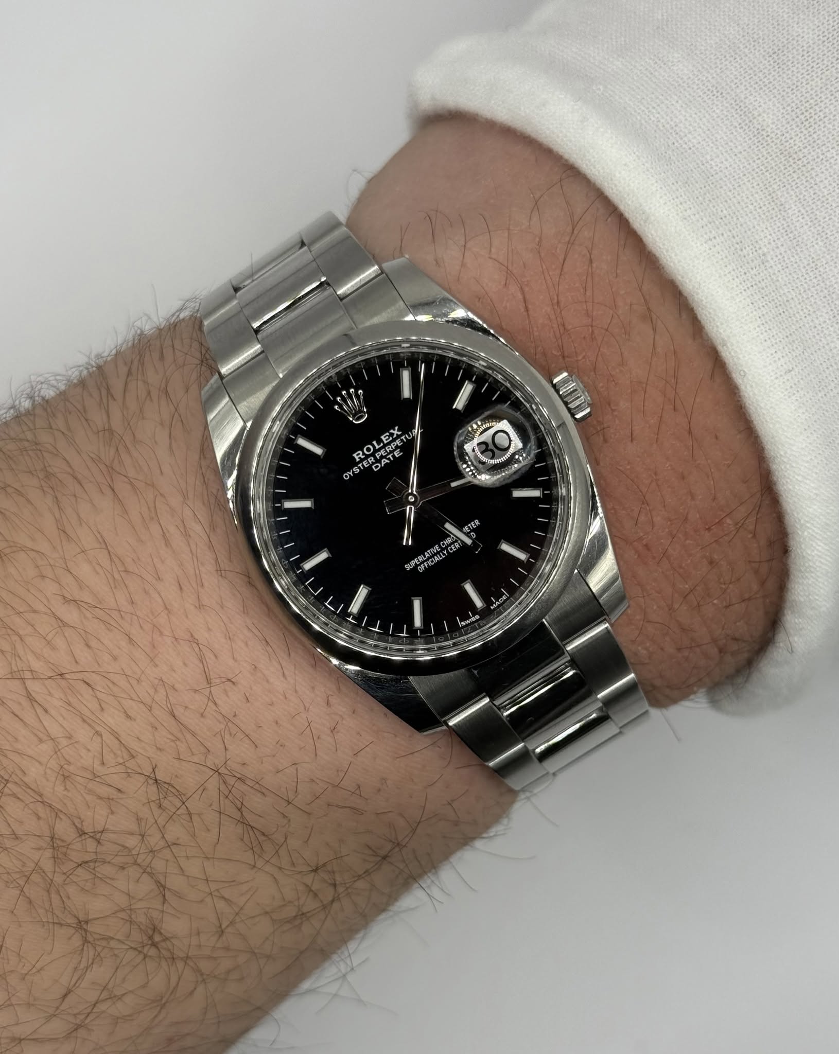 May be an image of wrist watch and text