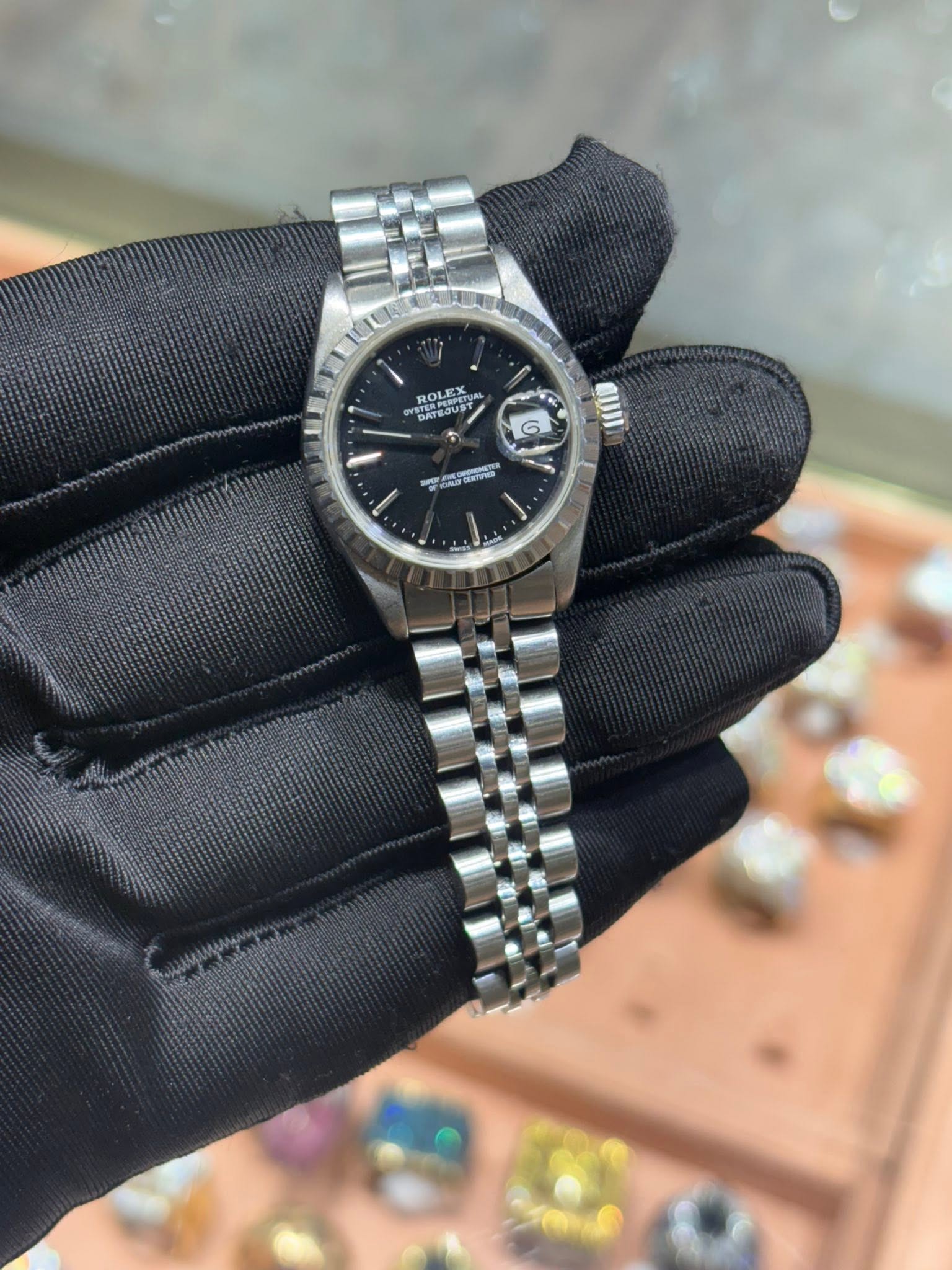 May be an image of wrist watch and text