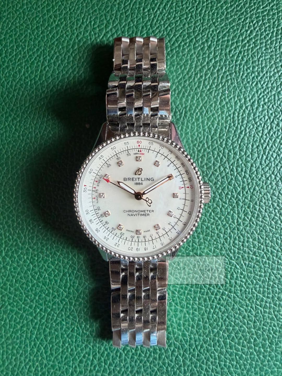 May be an image of wrist watch and text that says '60 55 55 TT LI 55 a 50 45 50 as 9 Ei 40 E 351 BREITLING LING 1884 DE 釣斸煉 HRONOMETER NAVITIMER 22 Oa谢aA 02 GI 9 9t 20 20'