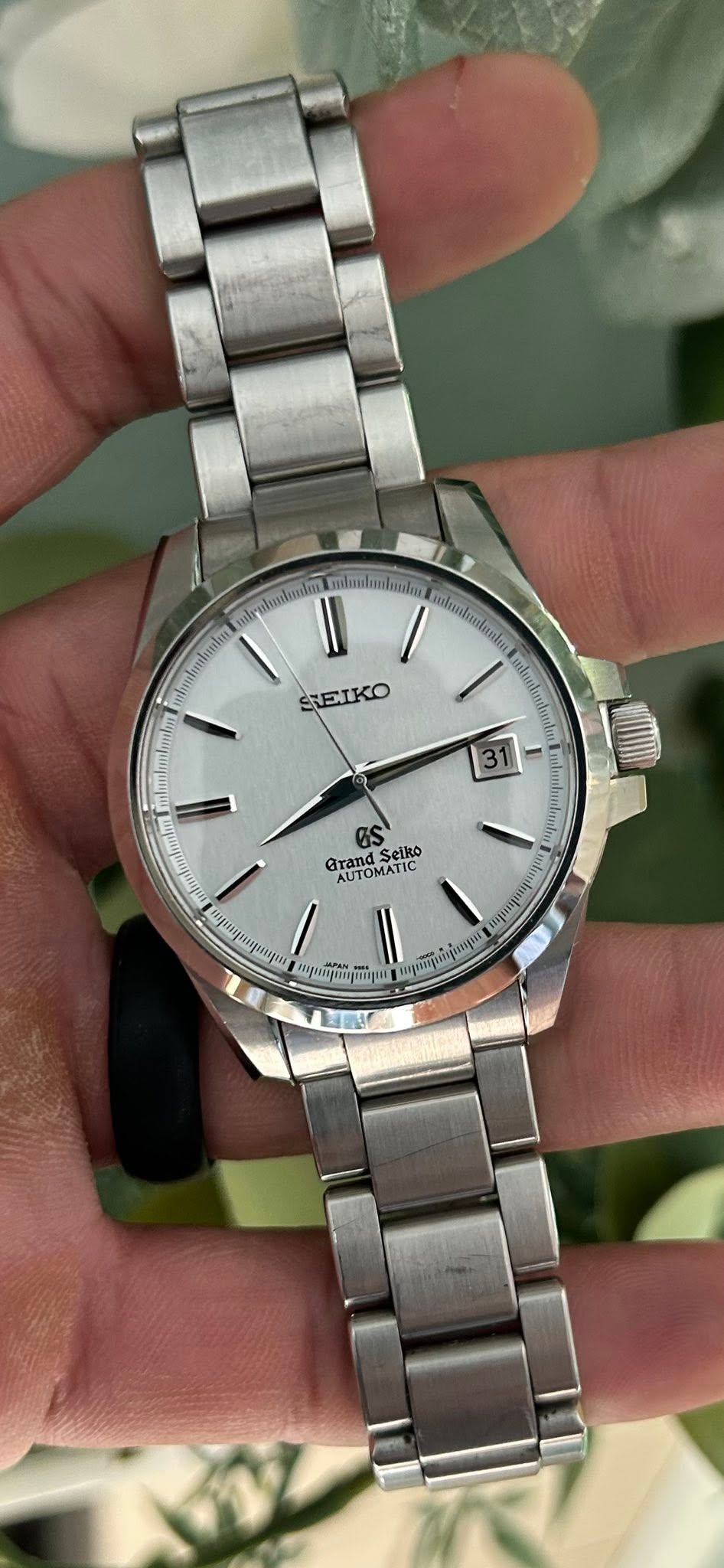 May be an image of wrist watch and text