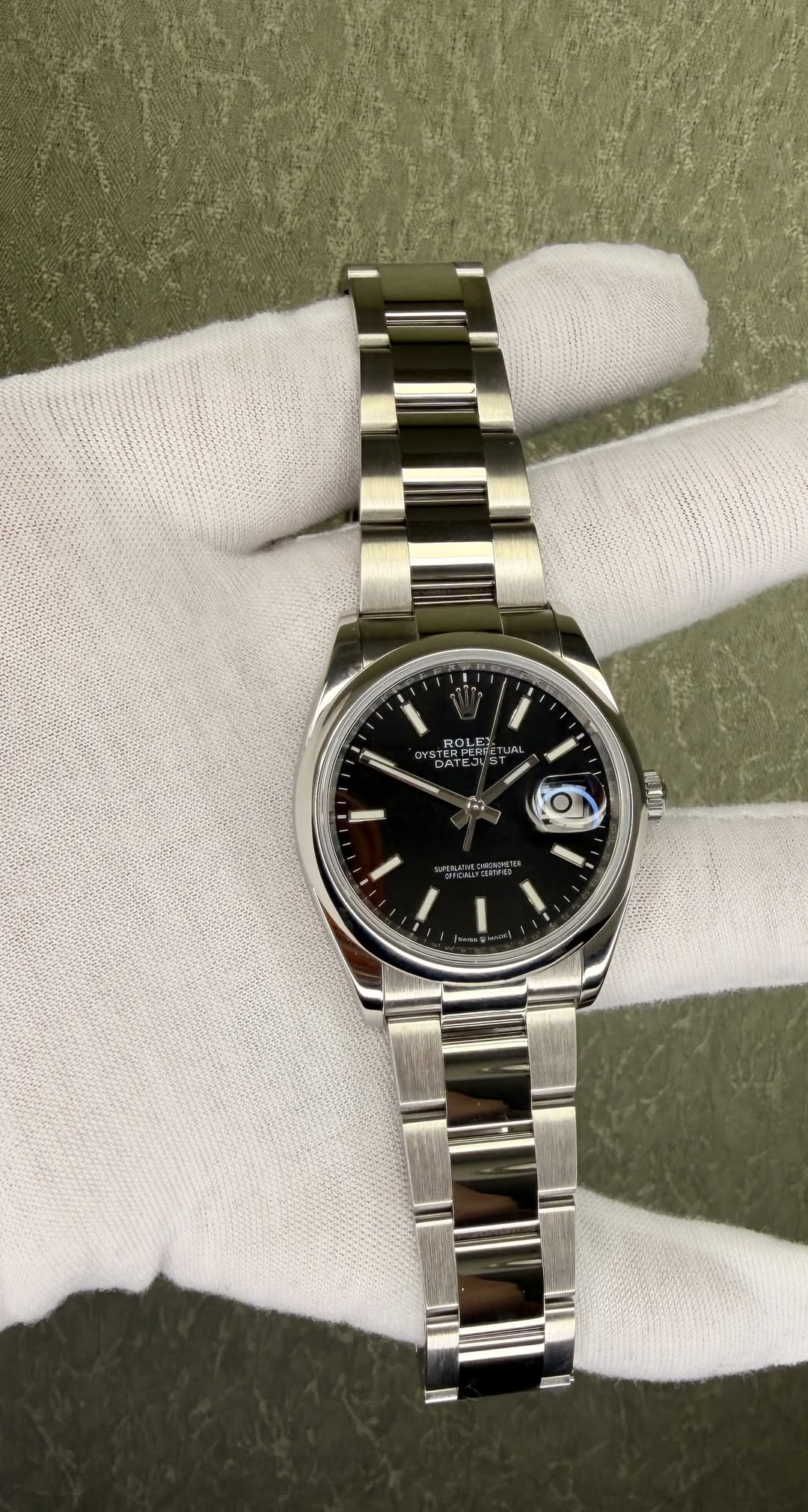 May be an image of wrist watch and text