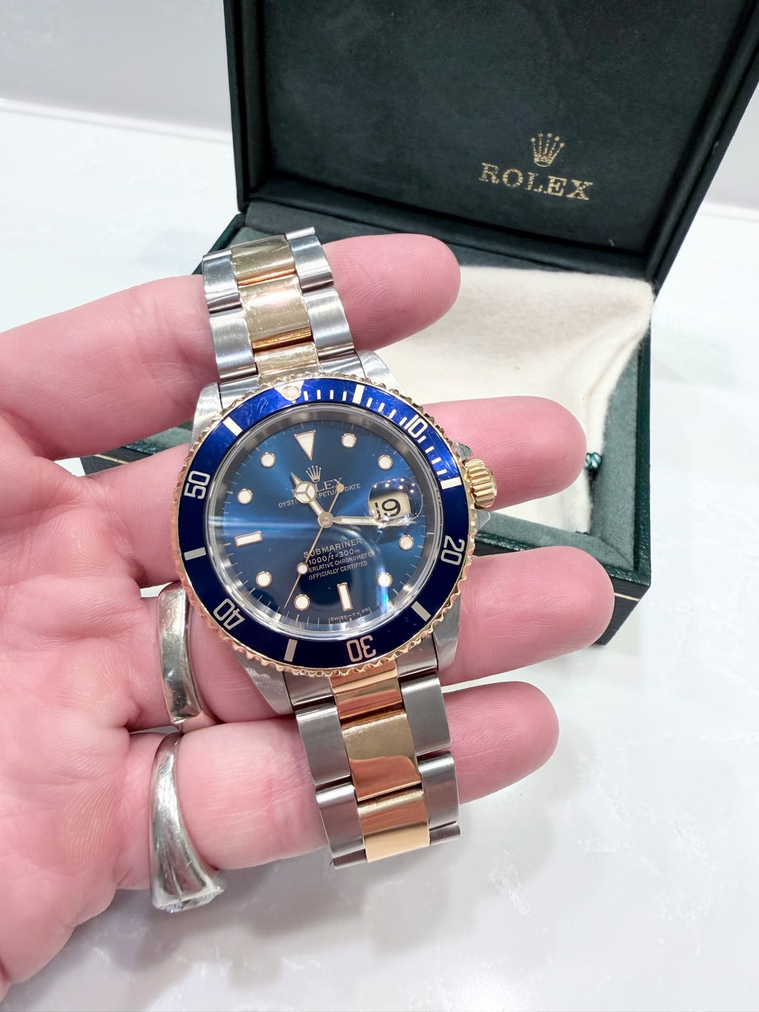 May be an image of wrist watch and text
