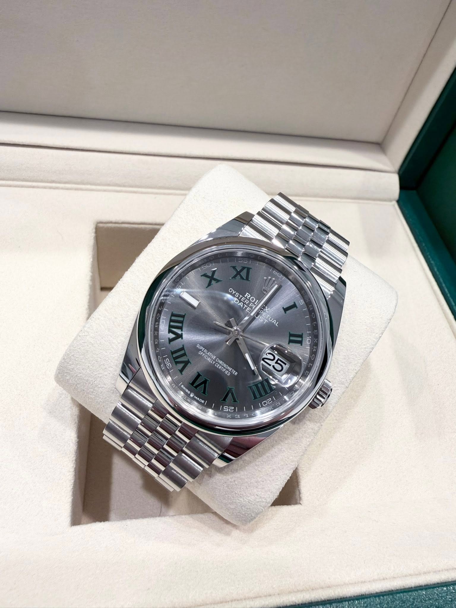 May be an image of wrist watch and text