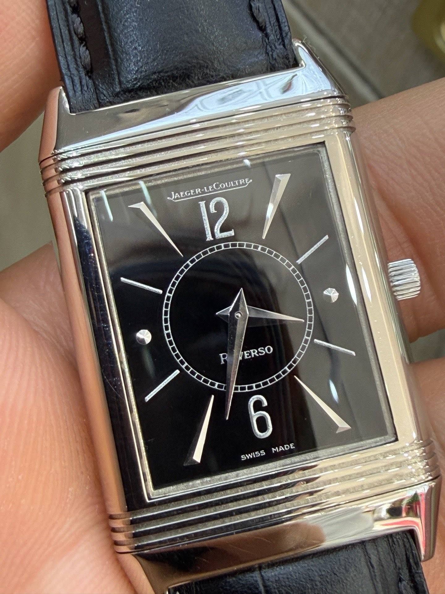 May be an image of wrist watch and text that says 'JAEGER-LE.COULTRE JAEGE AEGER-LE ECOULTRE 12 1 R ERSO ERSO /6 ANONCR 6 MADE SWISS'