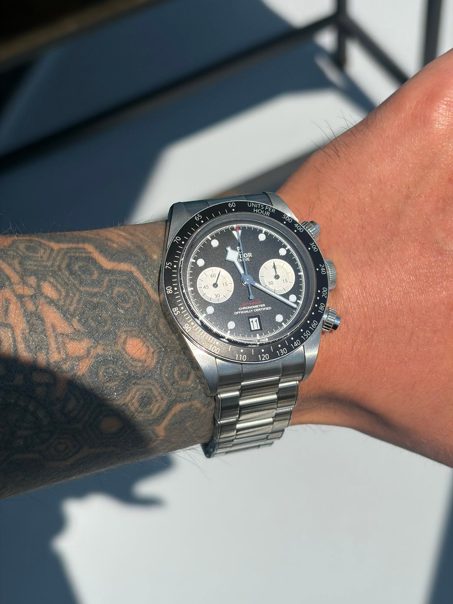 May be an image of wrist watch and text