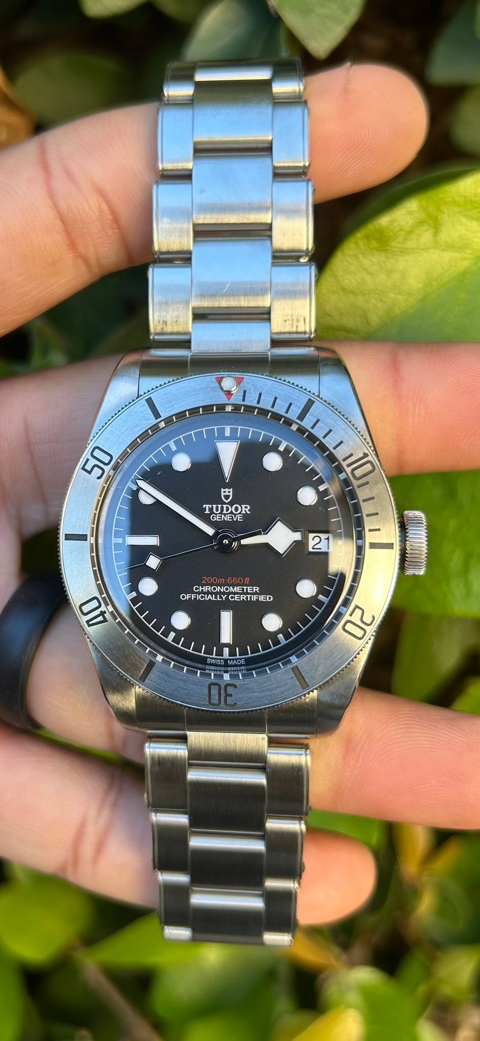 May be an image of wrist watch and text