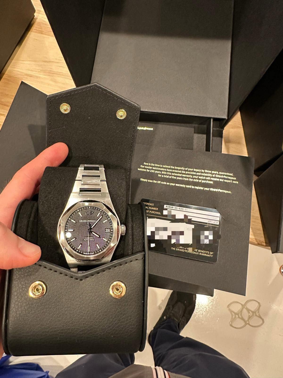 May be an image of wrist watch and text