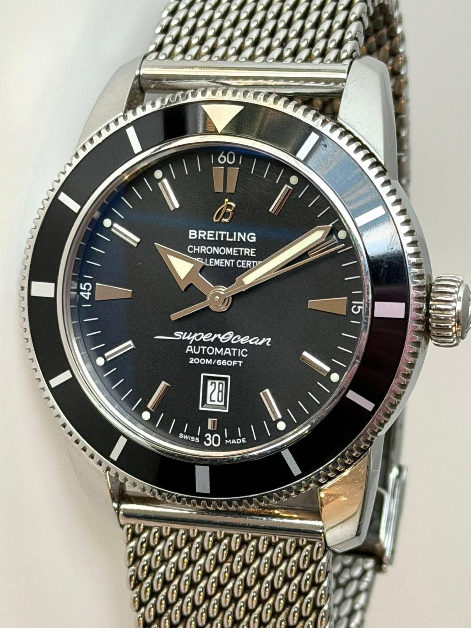 May be an image of wrist watch and text that says 'I 60 II お BREITLING CHRONOMETRE CLLEMENT CERTI E 45 15 superecean AUTOMATIC 200M/660FT 200M 660FT I EE 28 n SWISS 30 MADE'