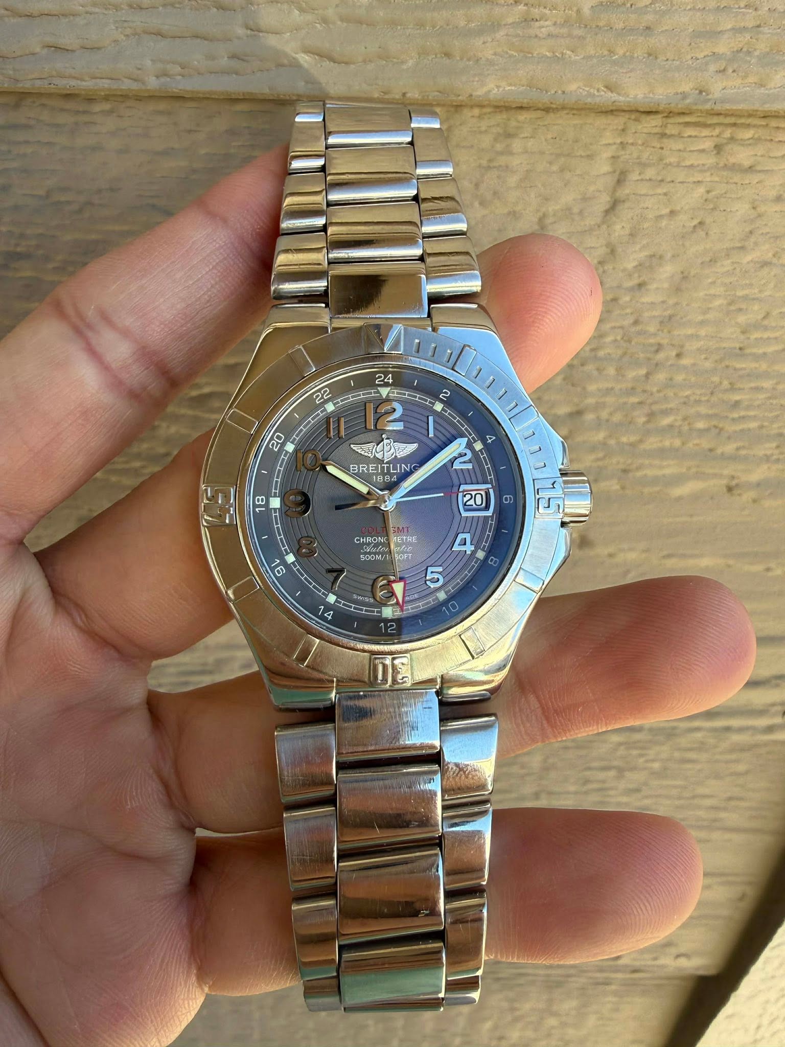 May be an image of wrist watch and text that says '22 24 CCE 2 20 BREITLING LIN BREI O GMI: CHROING KETRE 500M/ Tesa ー 14 O الت'