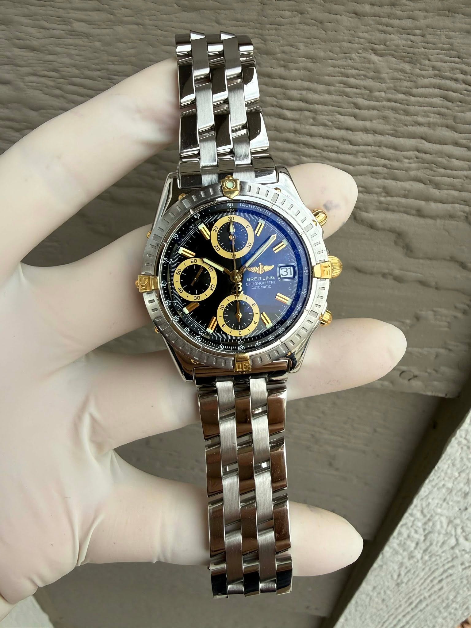 May be an image of wrist watch and text