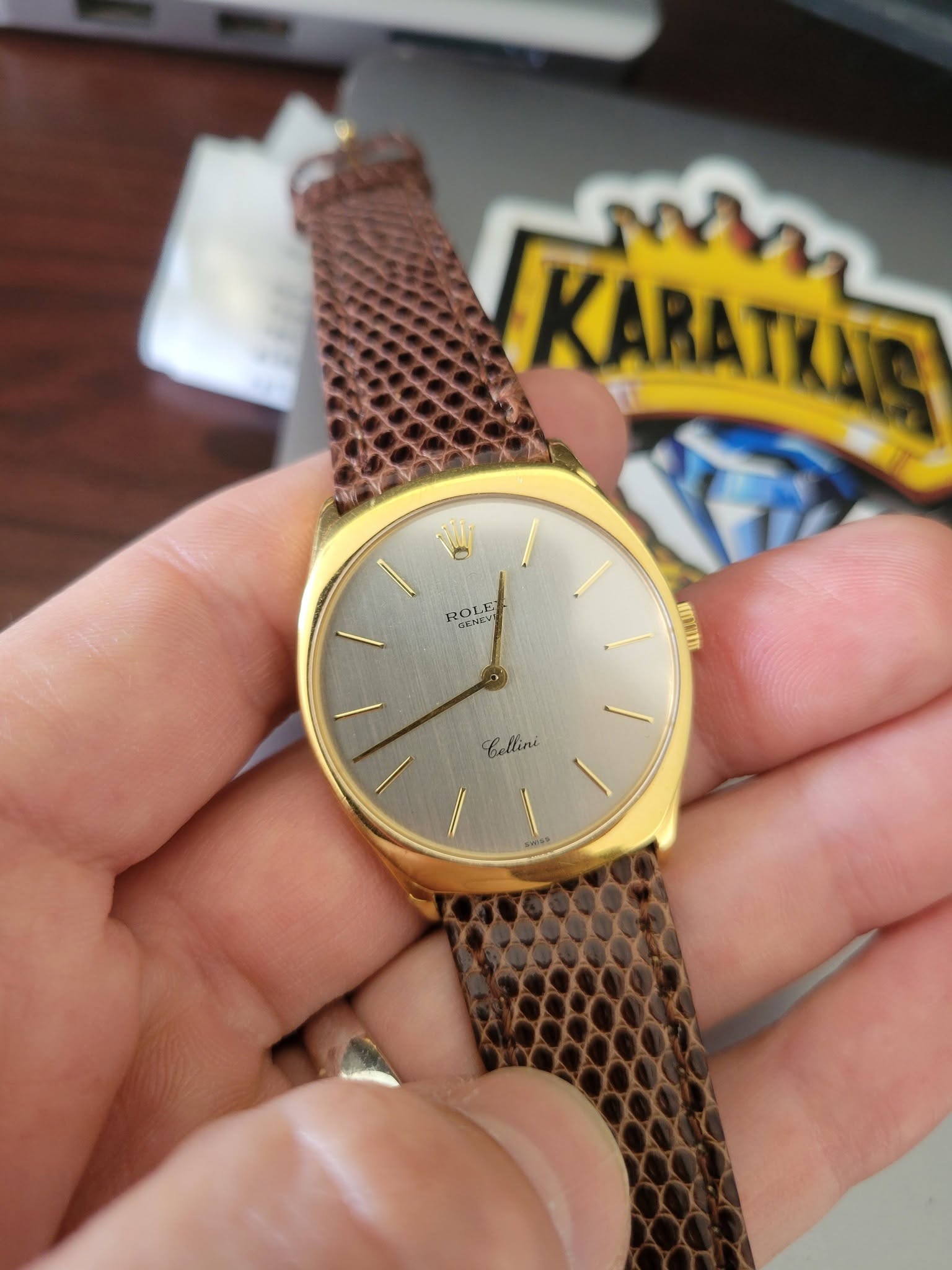 May be an image of wrist watch and text