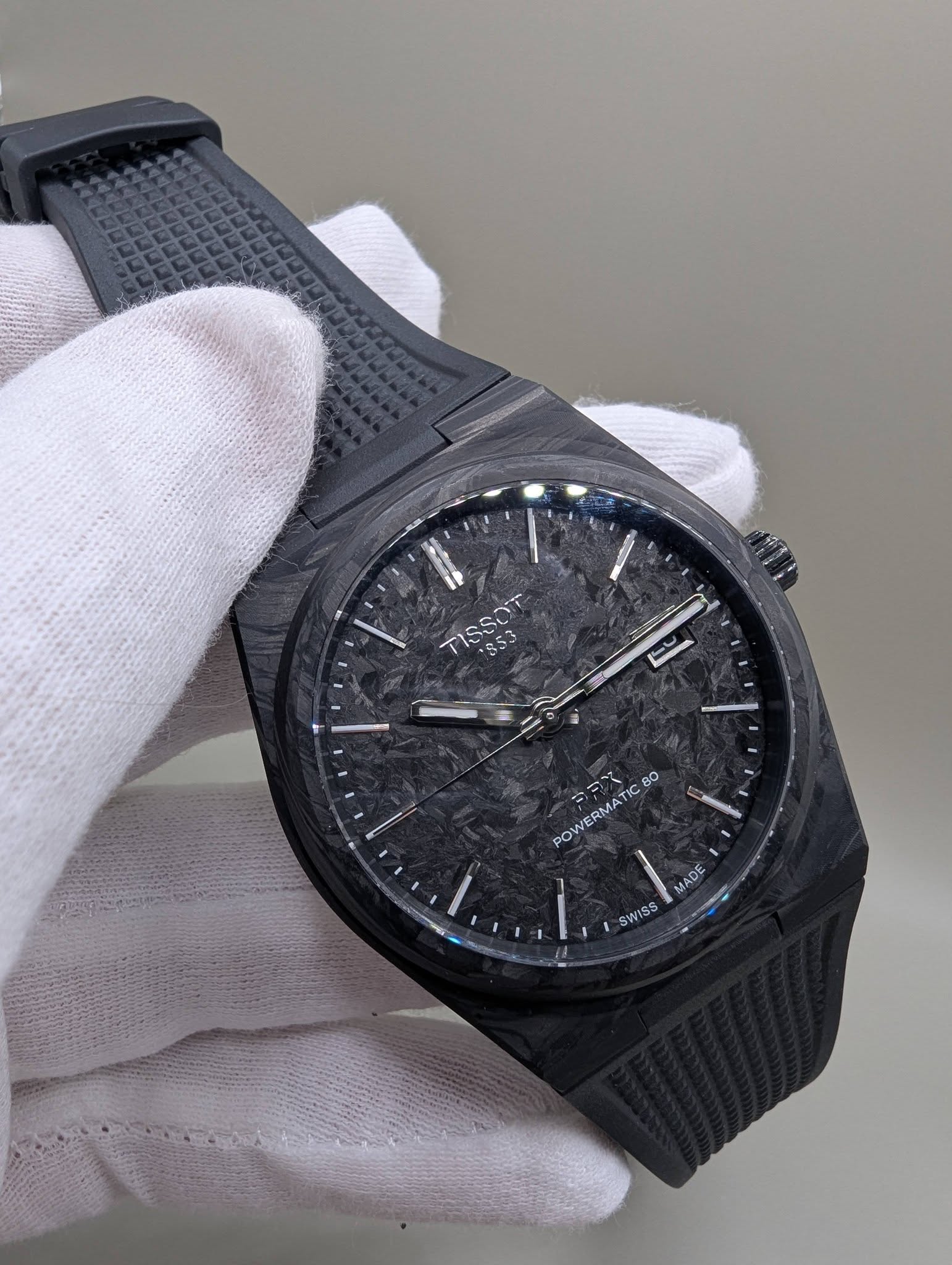May be an image of digital watch and text that says 'TISSOT 85. 1353 POW POWERMATIC 80 SWISS'