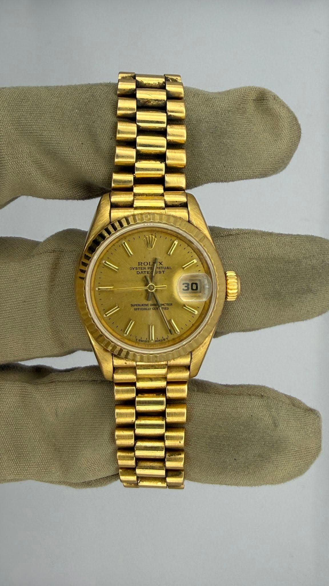 May be an image of wrist watch and text