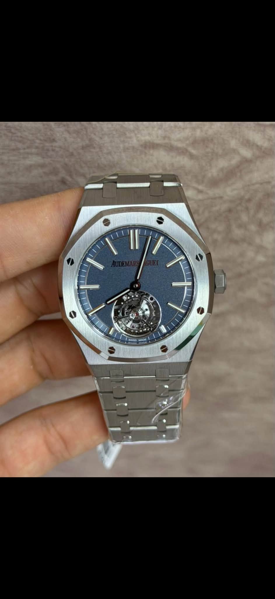 May be an image of wrist watch and text