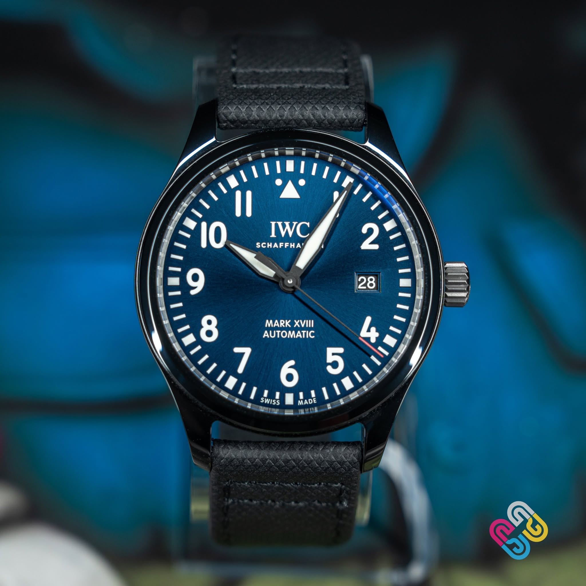 May be an image of wrist watch and text that says '2 |28 II 10 IWC SCHAFFHA 9 8 MARK XVIII AUTOMATIC HADE 11 SWISS MADE ഒൂള'