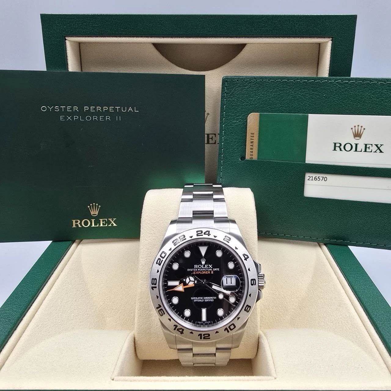 May be an image of wrist watch and text that says 'OYSTERPERPETUAL OYSTER PERPETUAL EXPLORER BUARANTEE TEE ROLEX 216570 ROLEX ROLE ROLE OLE ALO RWENTBALORS RETHT II 18 9 בן 6…