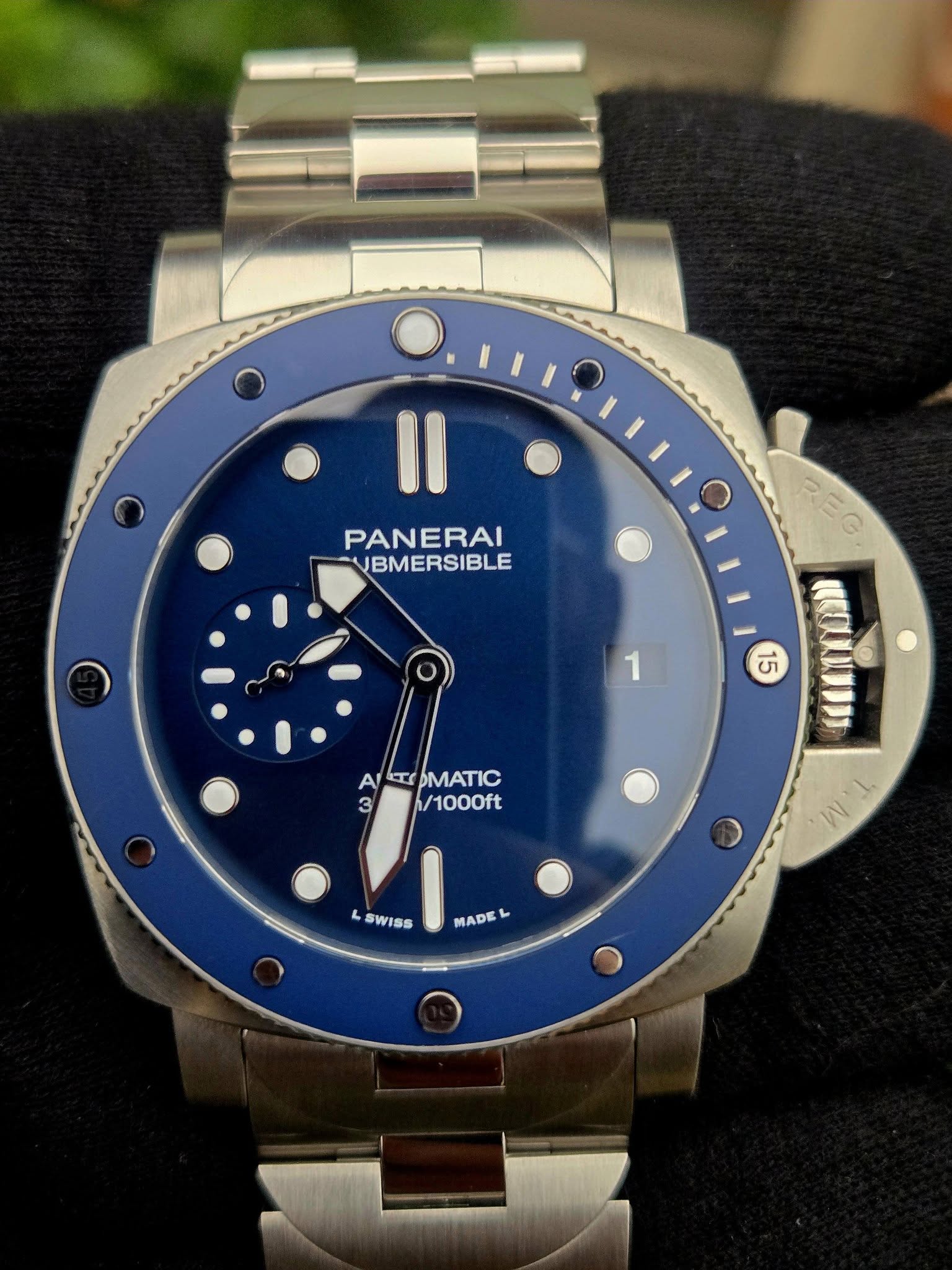 May be an image of wrist watch and text that says 'Il PANERAI VBMERSIBLE 1 REG REG 55 KECULUNDD A AETCOMATIC ET OMATIC 3 11/1000ft /1000ft L SWISS W N MADE L'