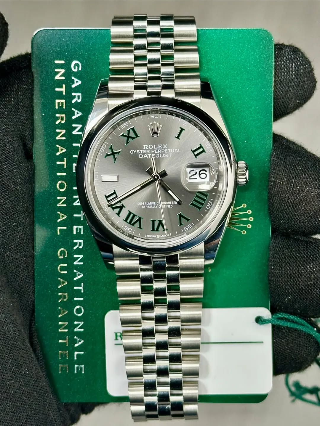 May be an image of wrist watch and text that says ' လှိ 20 INTERNATION ATIONAL AL GARANT I 50 ROL ROLEX EX OYSTE DATEJUST DAT II 26 NTERNATIONALE ATIONALE TERNATIONAL 까스 Aи…
