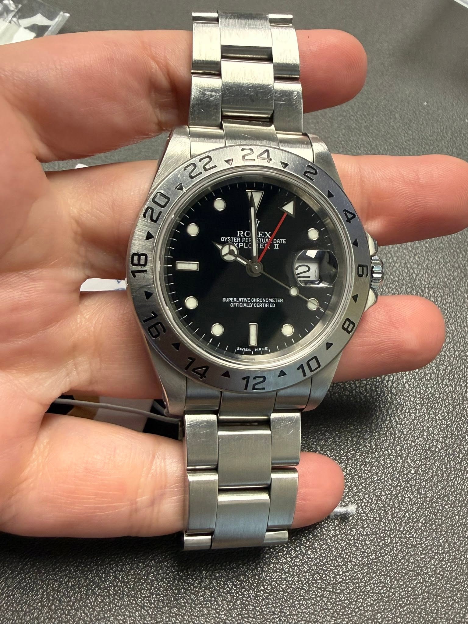 May be an image of wrist watch and text