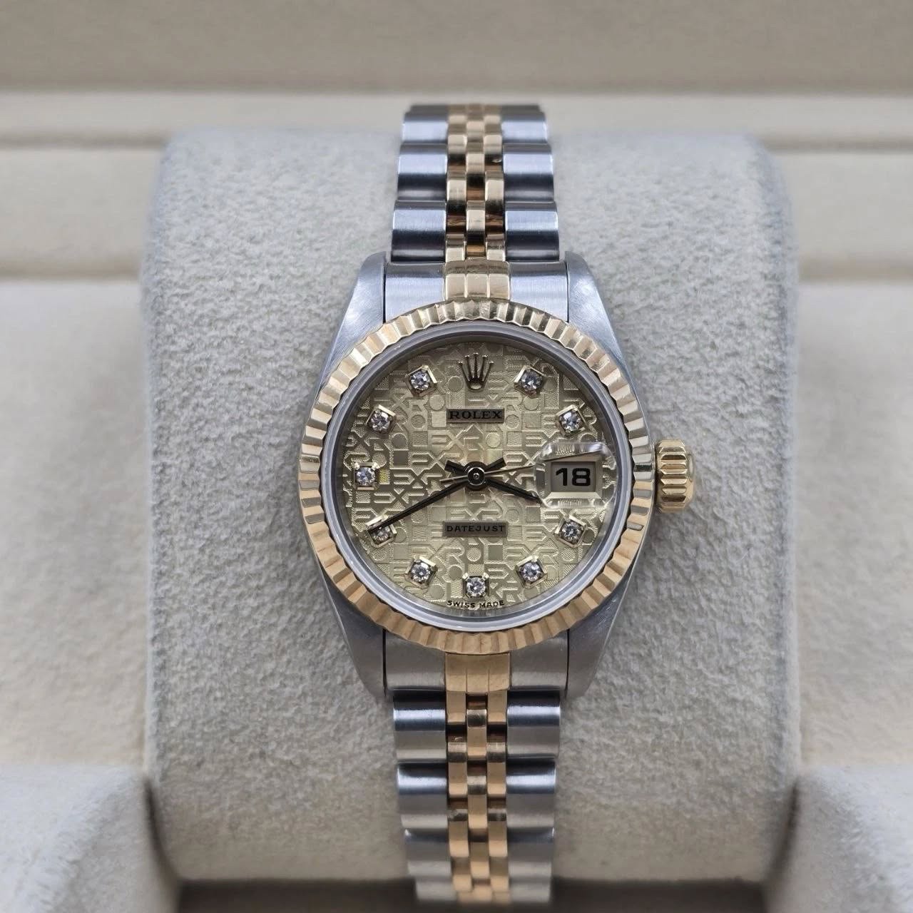 May be an image of wrist watch and text