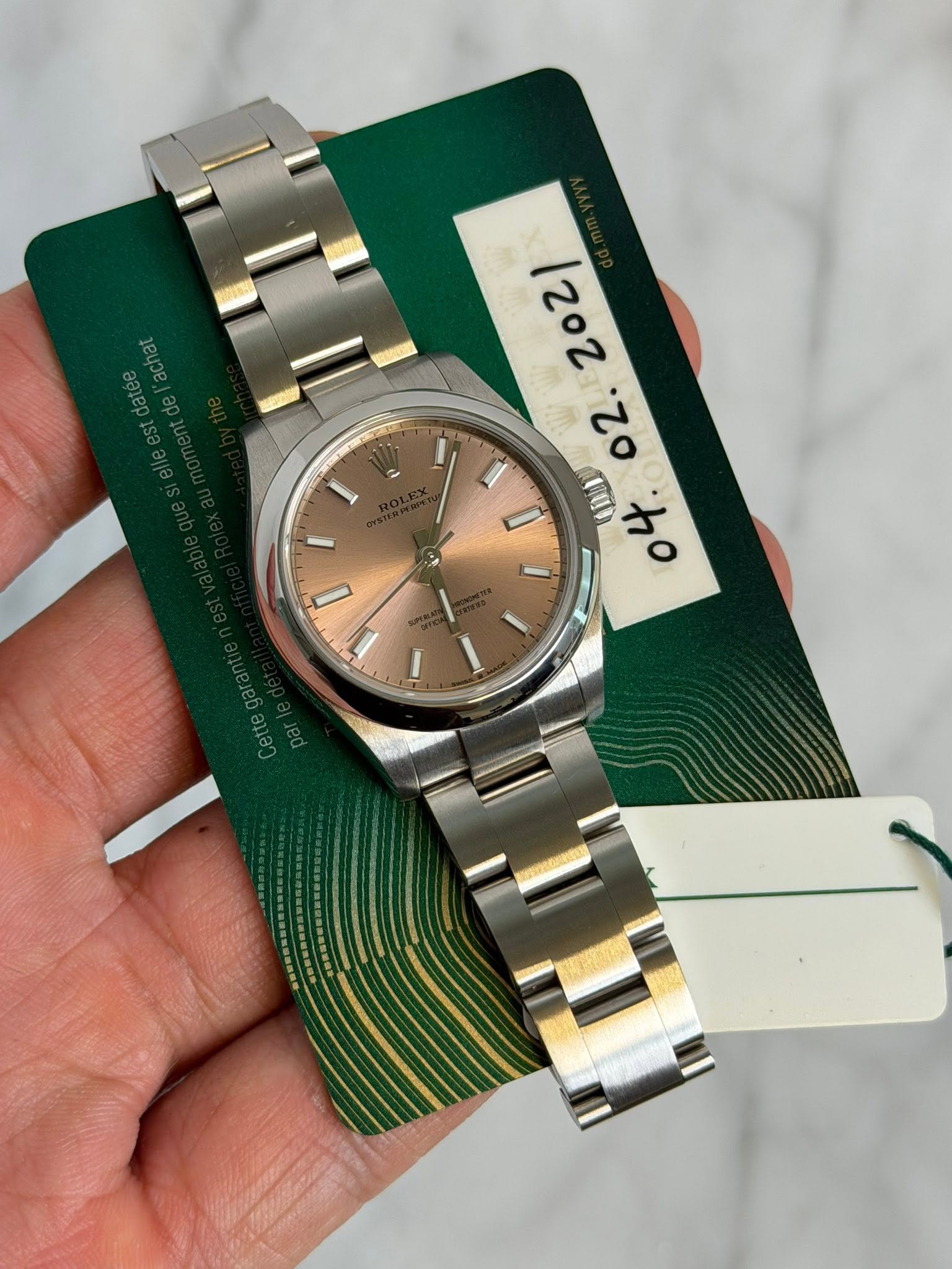 May be an image of wrist watch and text