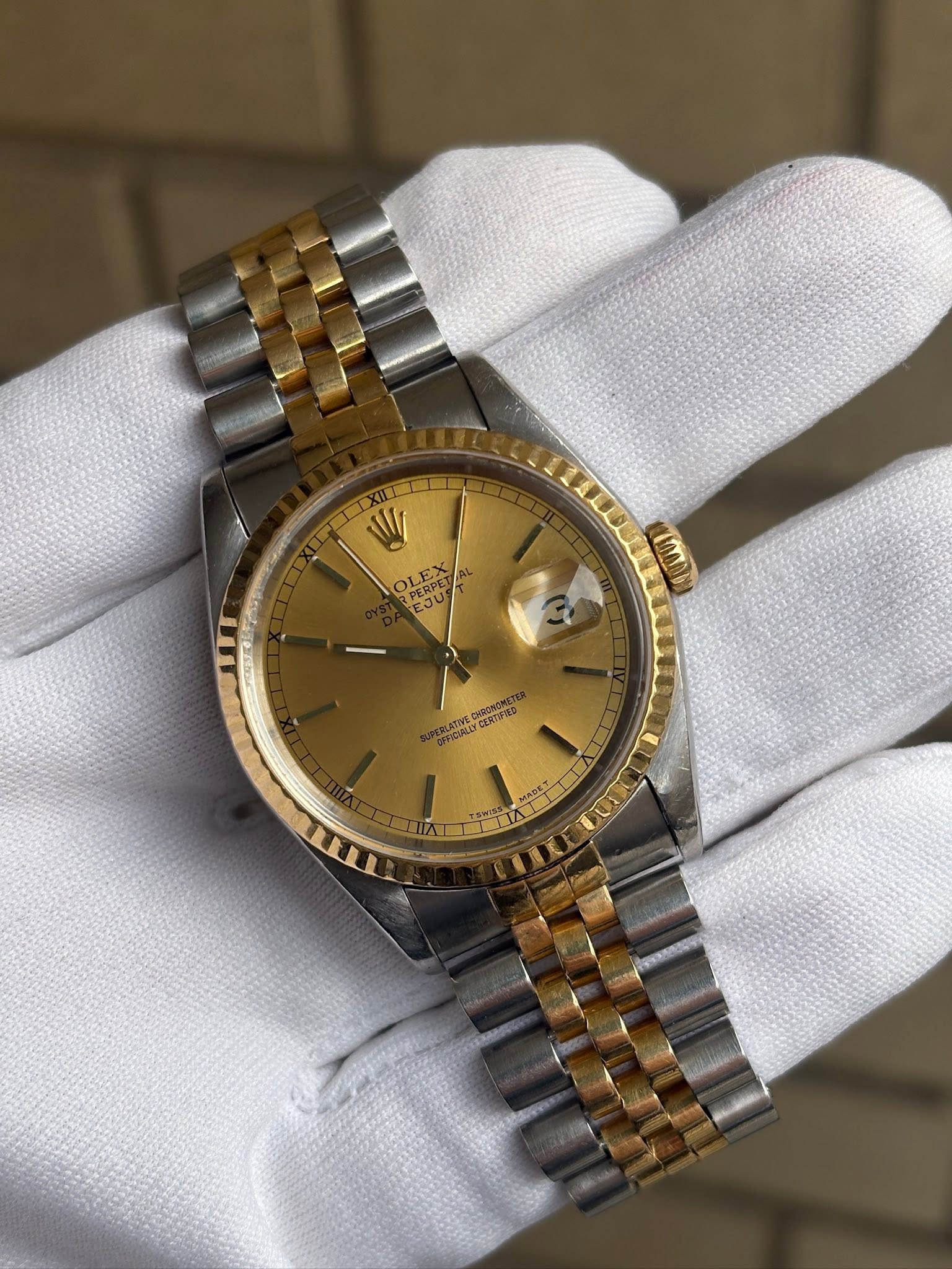 May be an image of wrist watch and text