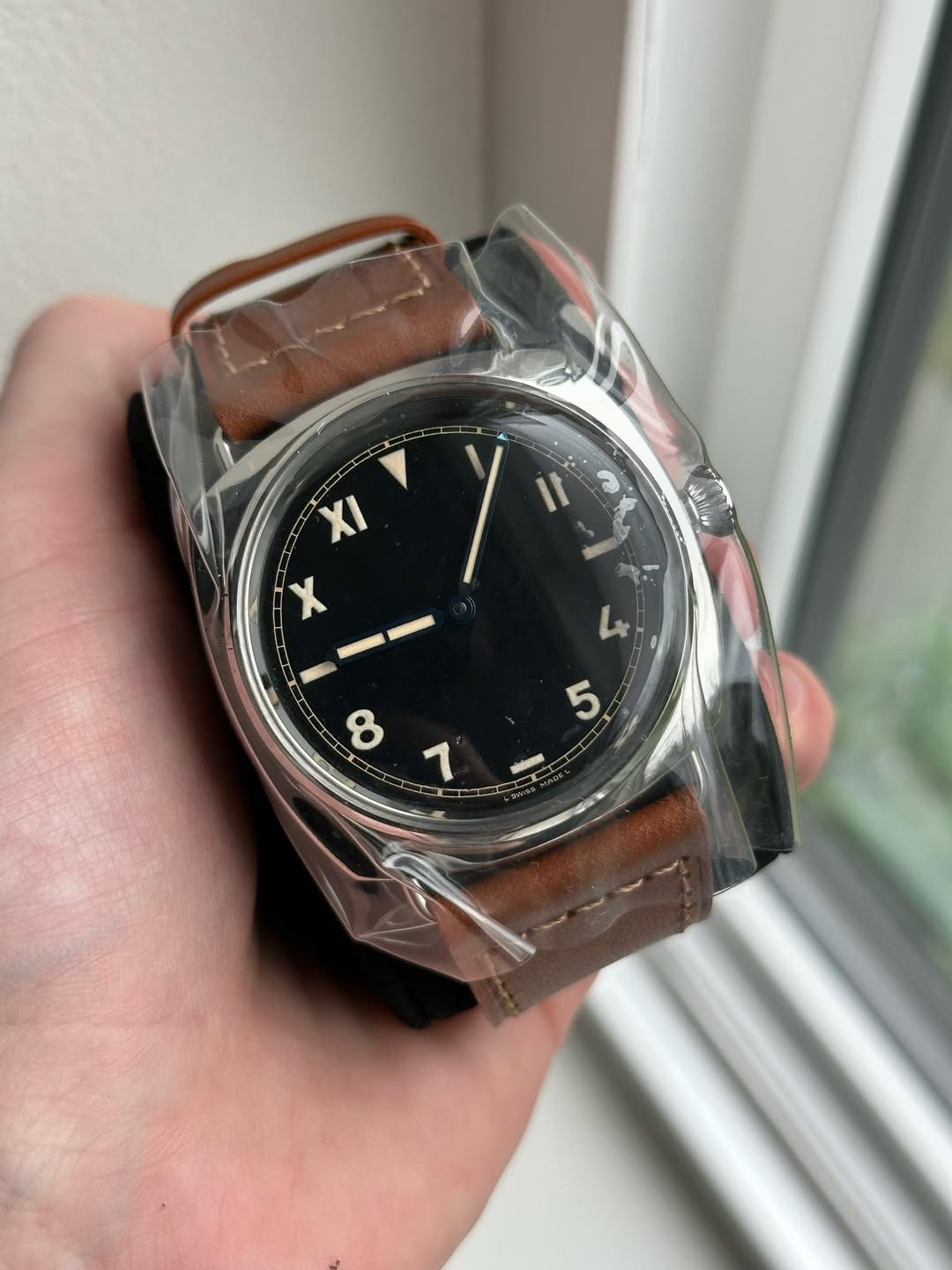 May be an image of wrist watch and text