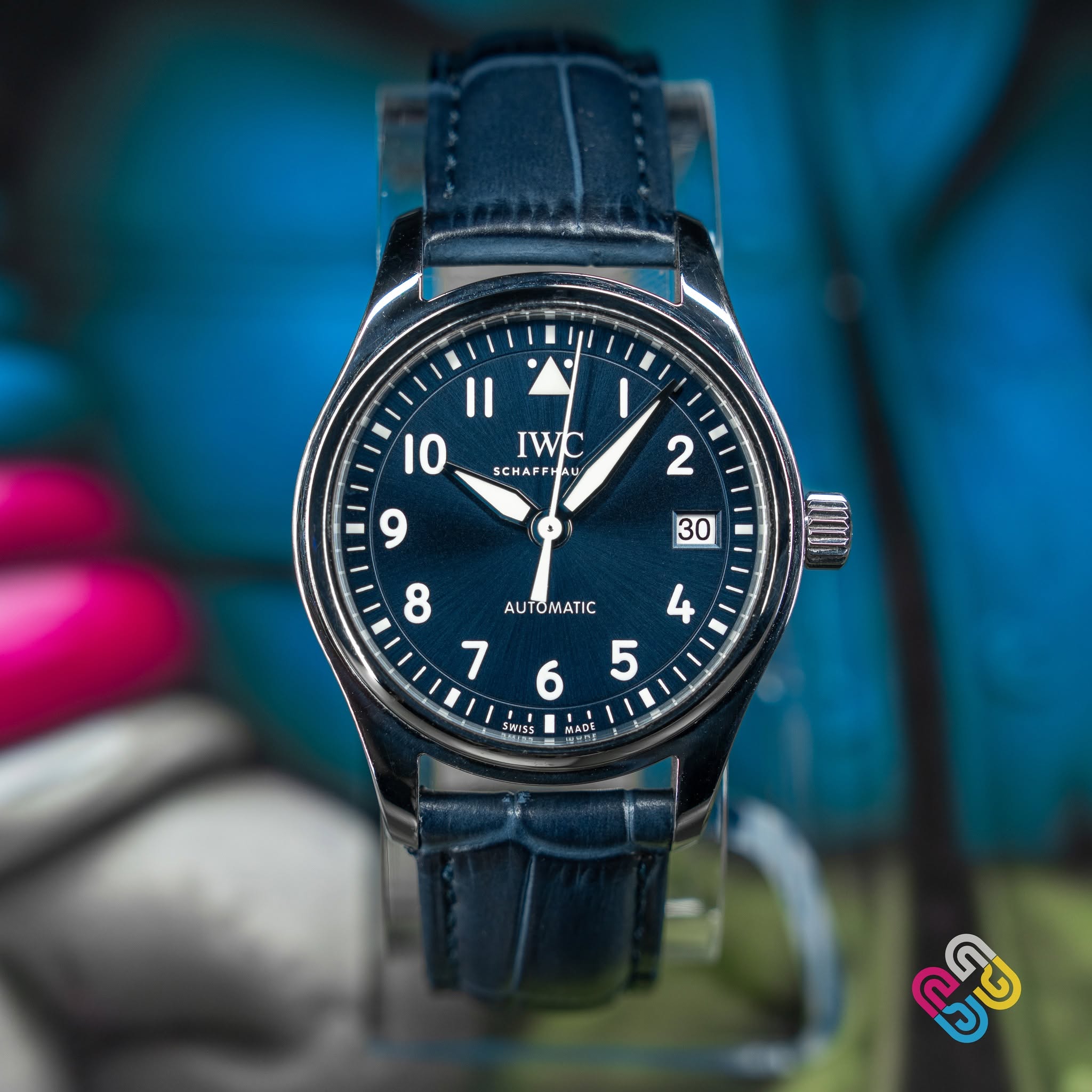 May be an image of wrist watch and text that says 'IWC AL A AL ករ SCHAFFI A MAr AUTOMATIC 7 5 4 6 H Ar A H1SS E 6 번이호 ARE លិខ'