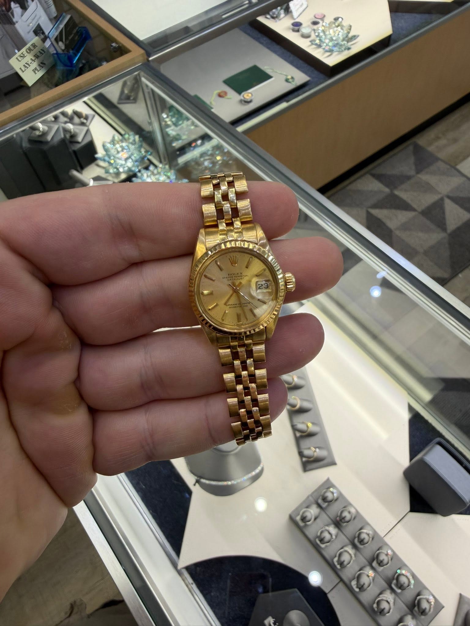 May be an image of wrist watch and text