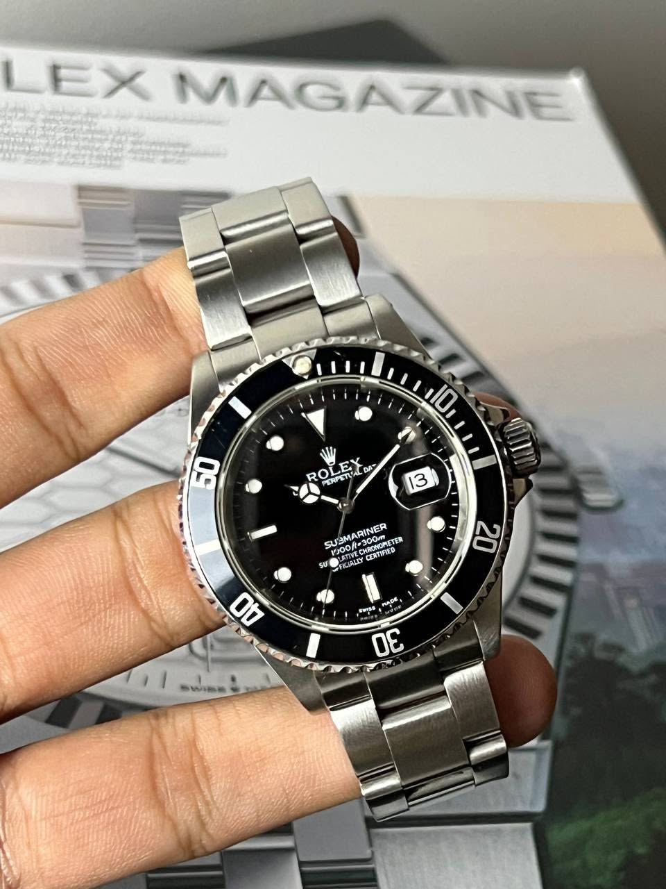 May be an image of wrist watch and text