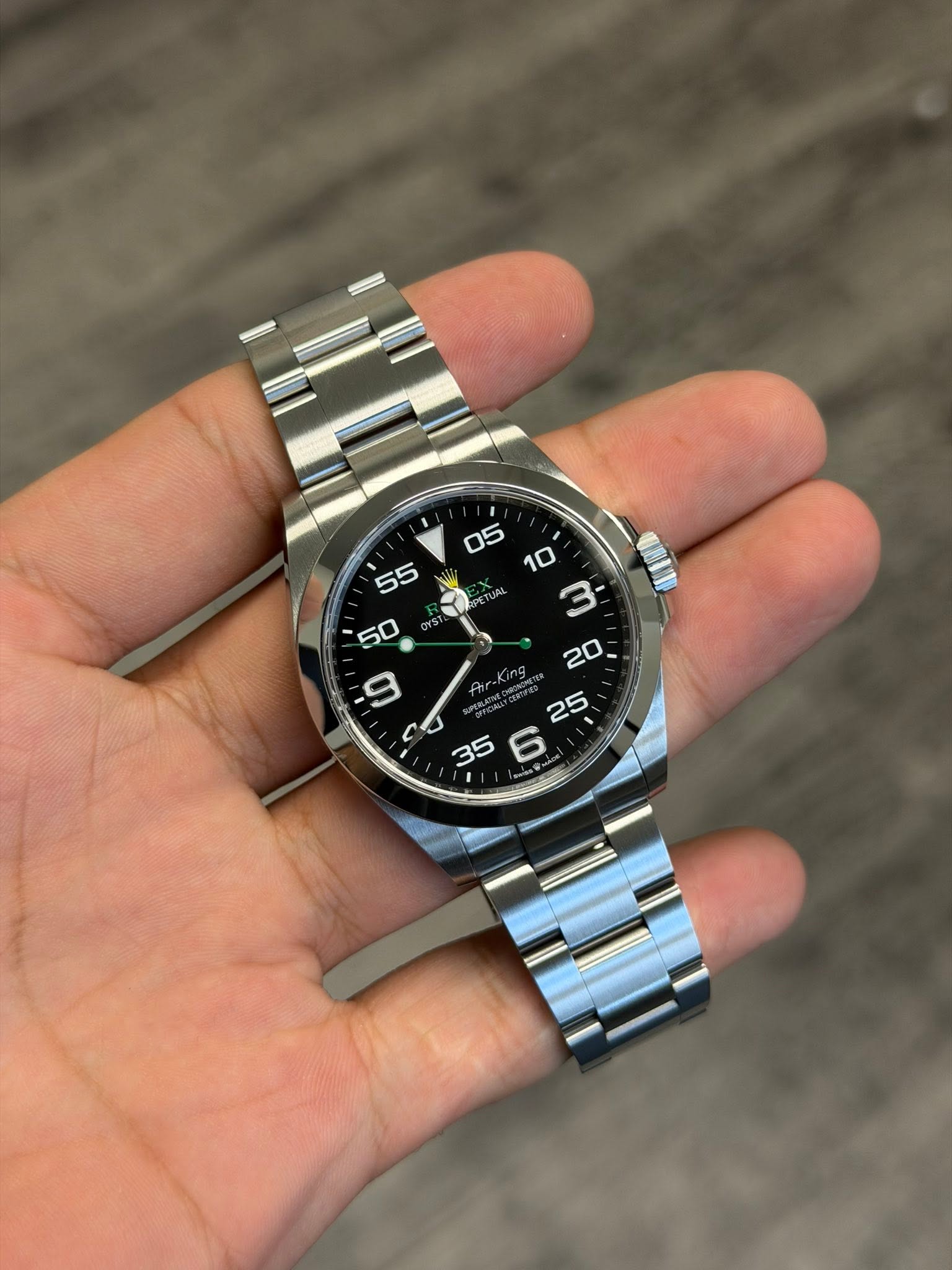 May be an image of wrist watch and text