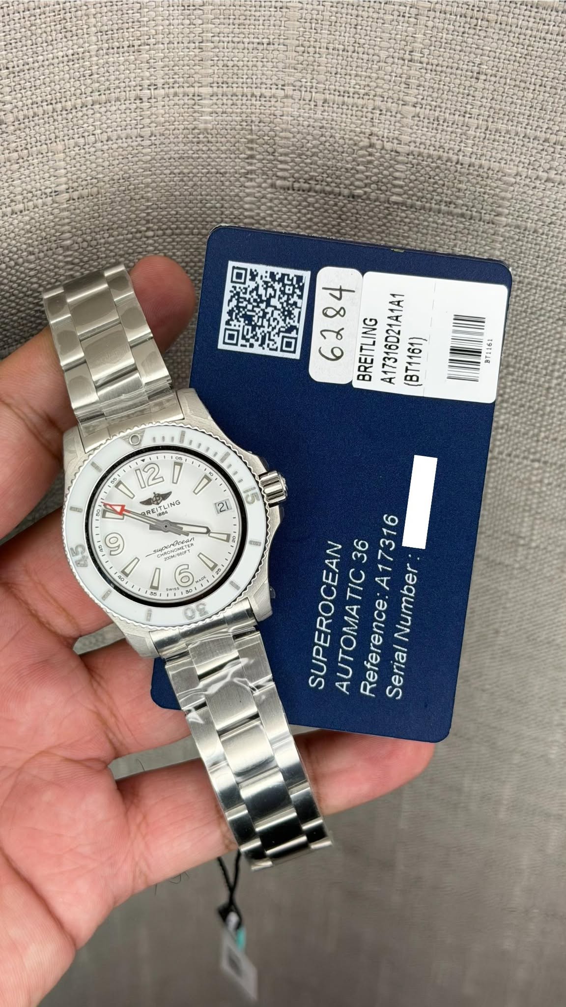 May be an image of wrist watch and text