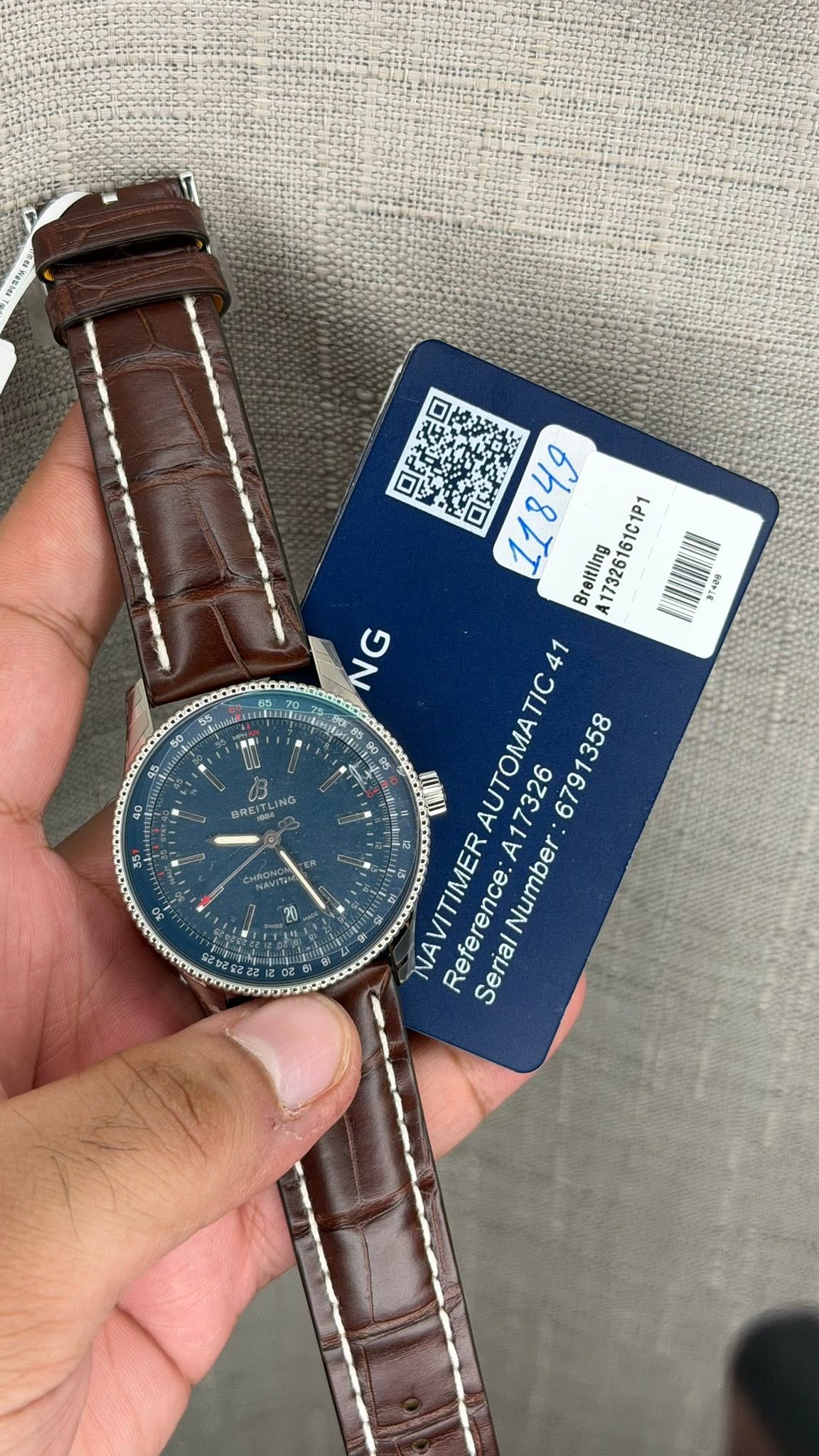 May be an image of wrist watch and text that says '可良究口 防 可生 Breitling 173261 61C1P1 WT4ee NG G N DR w N 41 τΙς AUTOMA NAVITIMER Refere Reference: Number Seria'