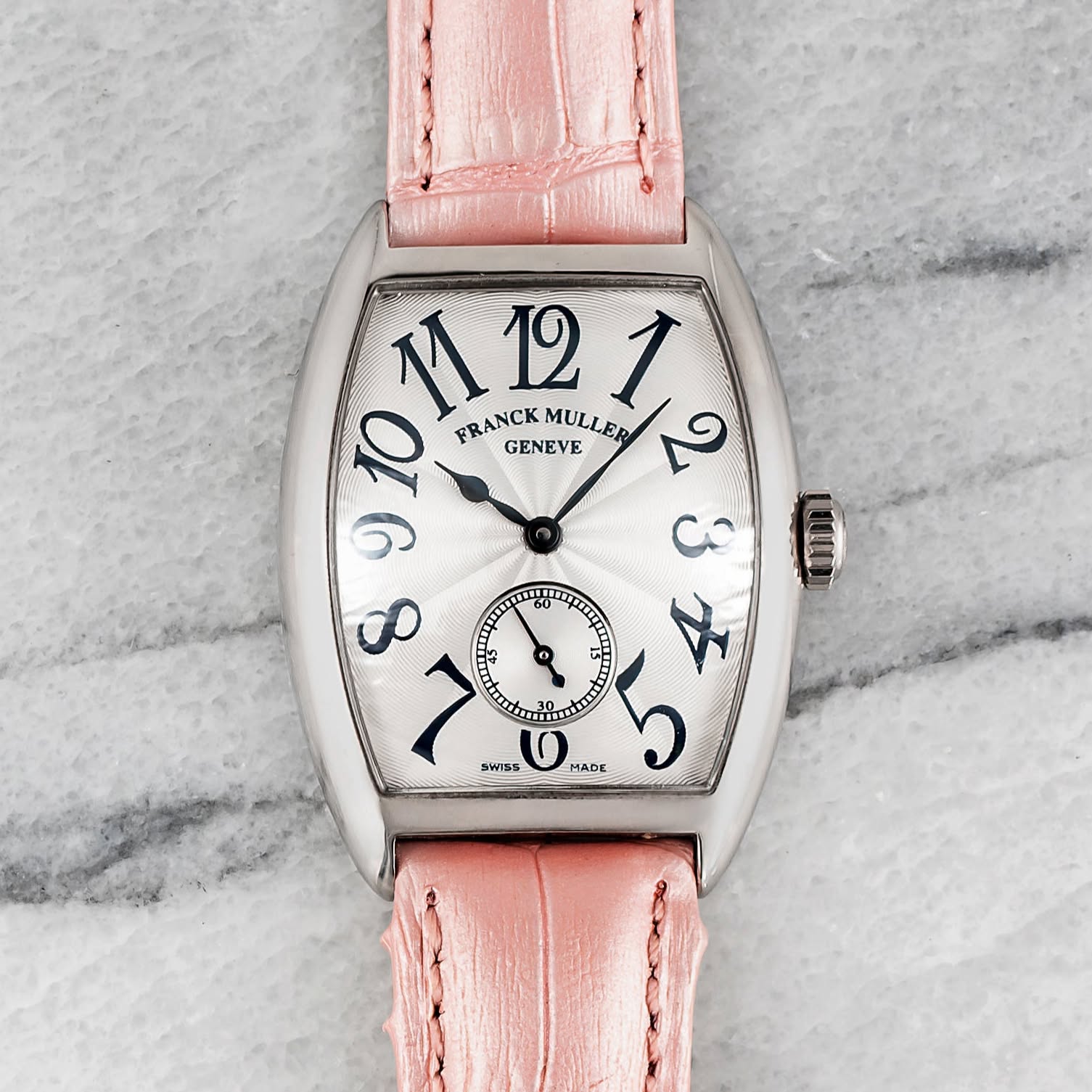 May be an image of leather, wrist watch and text that says '12 10 n FRANCKMULLER FRANCK GENEVE MULLER M121 ១១០ C LQL 7 SWISS TT 品 0 HADE ه 5'